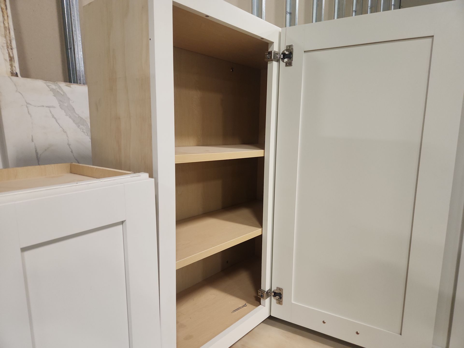 “The Westerly” Transitional White Kitchen with Island, 48" Sub-Zero Refrigerator and Bosch Appliances