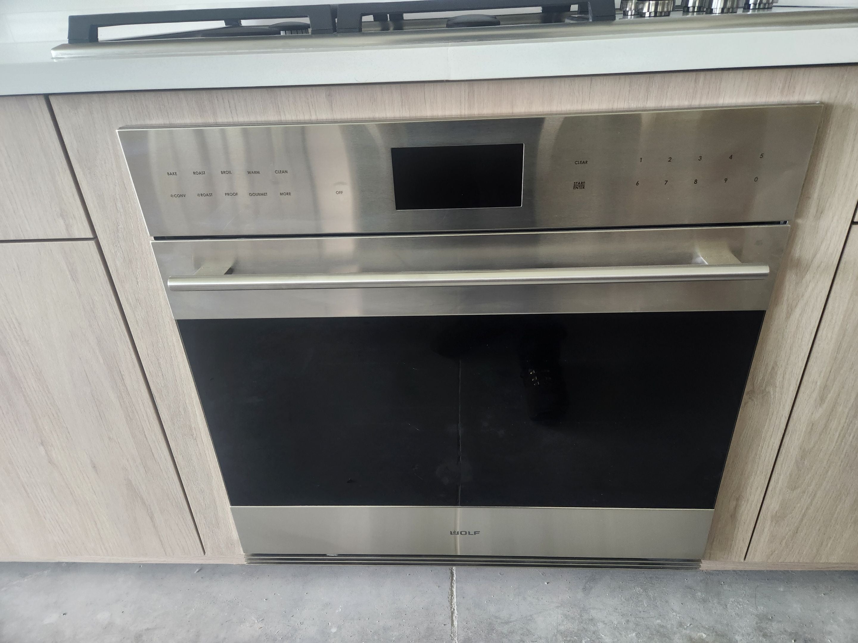 Cabico Sandy Oak Transitional Kitchen with Island & Wolf Appliances