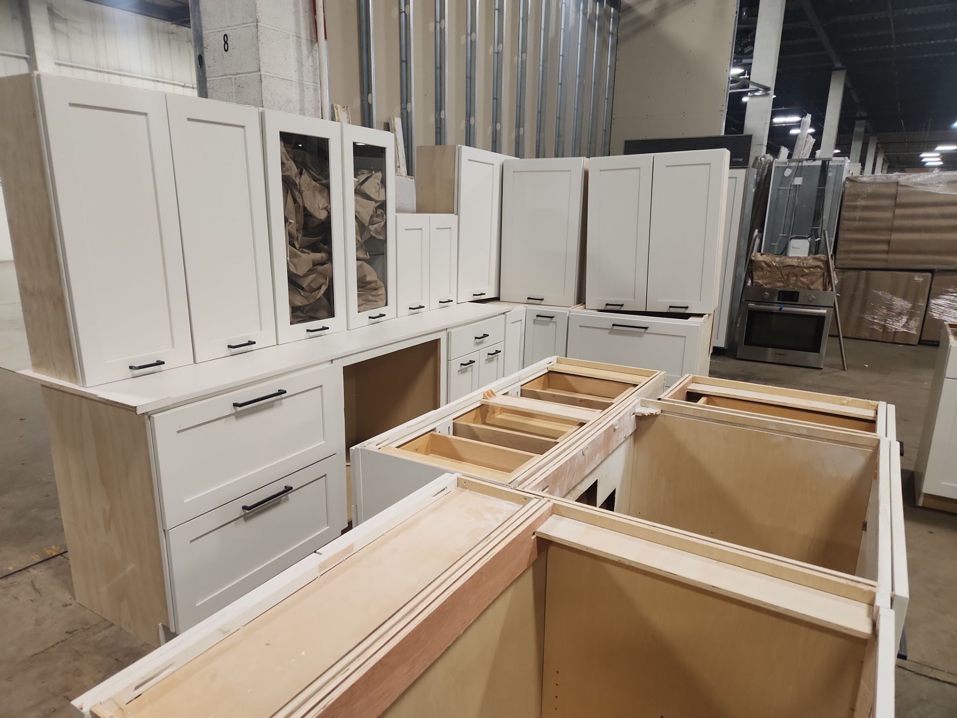 “The Westerly” Transitional White Kitchen with Island, 48" Sub-Zero Refrigerator and Bosch Appliances