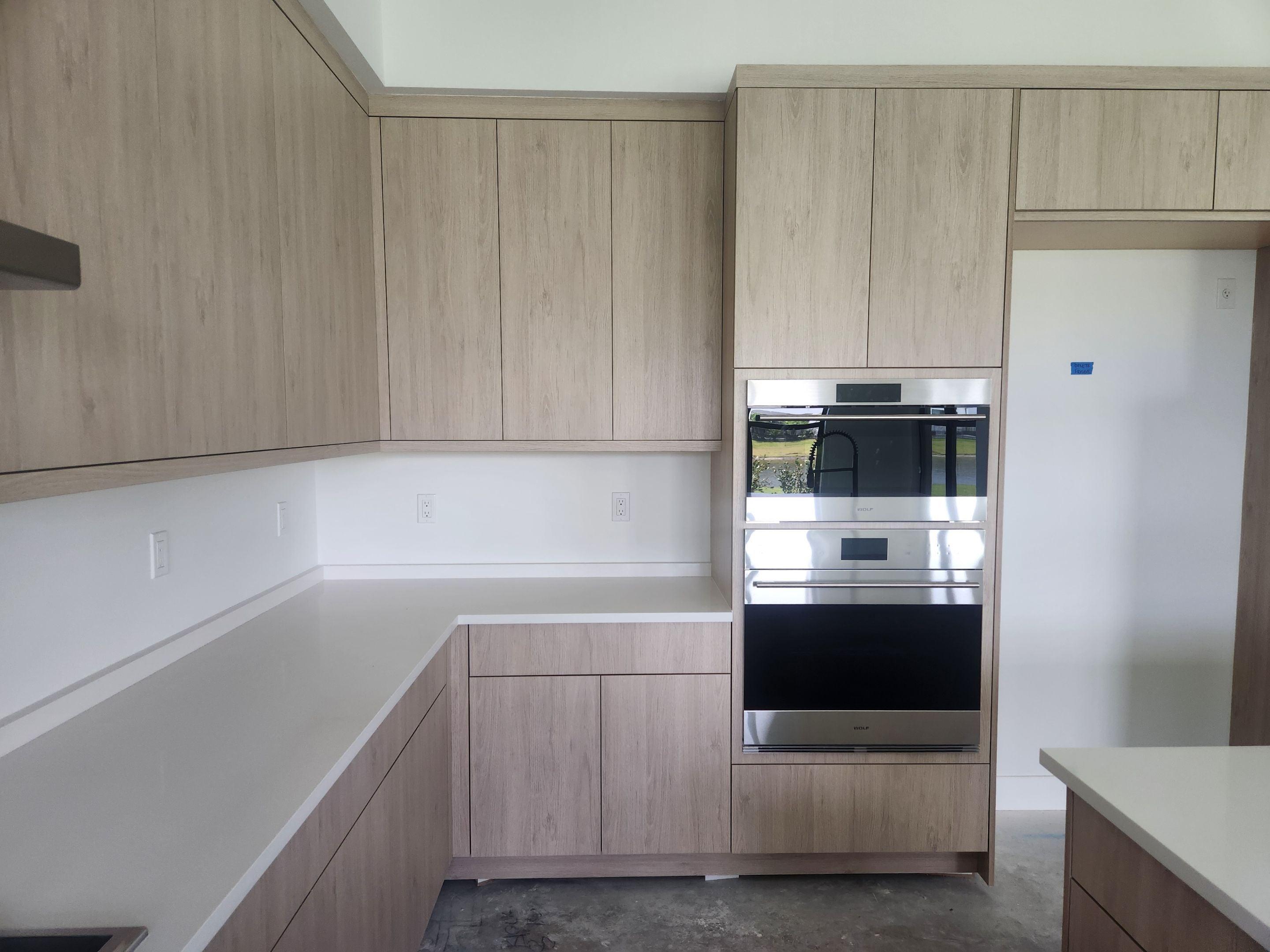 Cabico Sandy Oak Transitional Kitchen with Island & Wolf Appliances