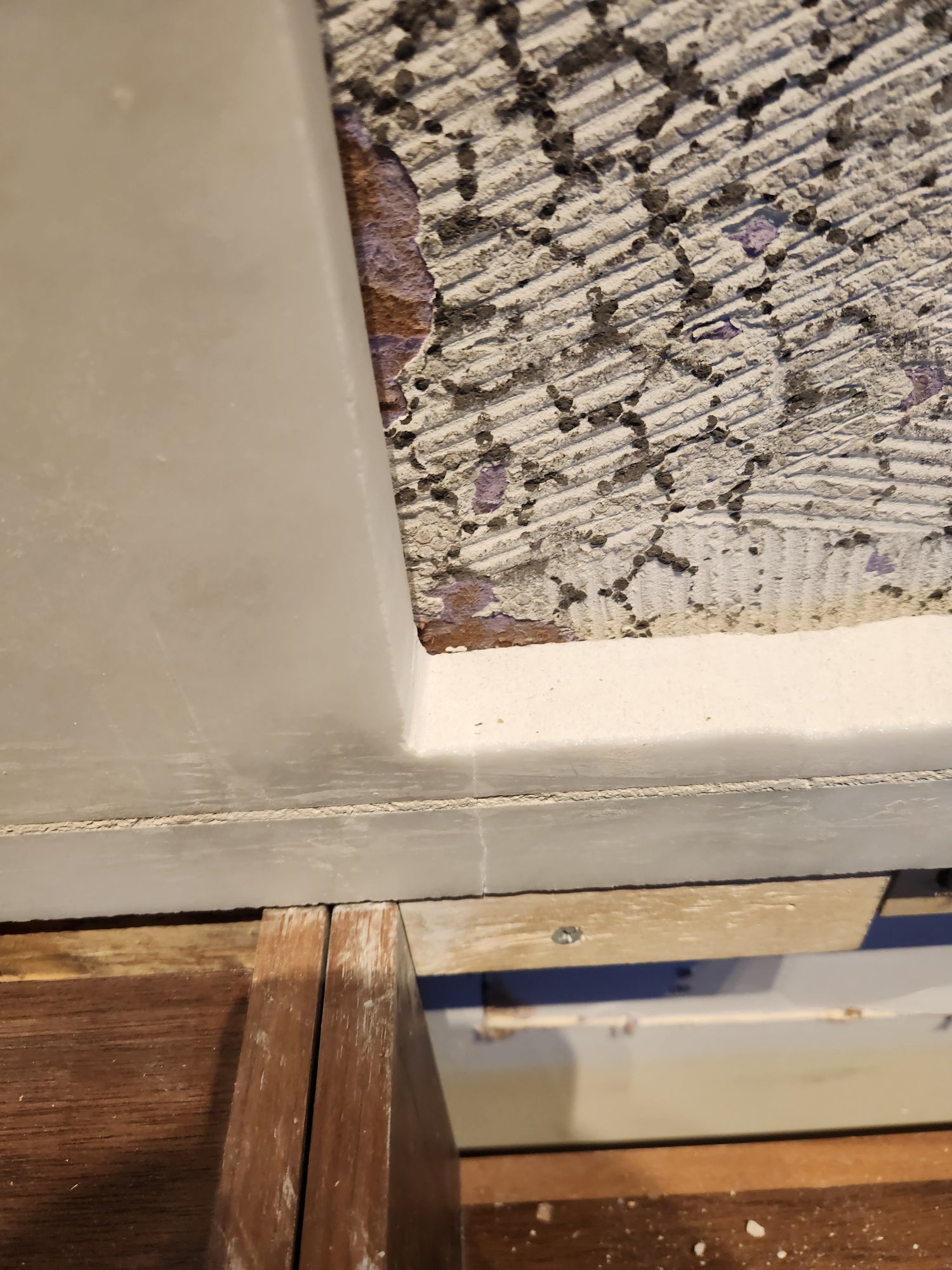 Modern White and Brown Wood Veneer Kitchen with Waterfall Island, Marble Countertops & Miele Appliances