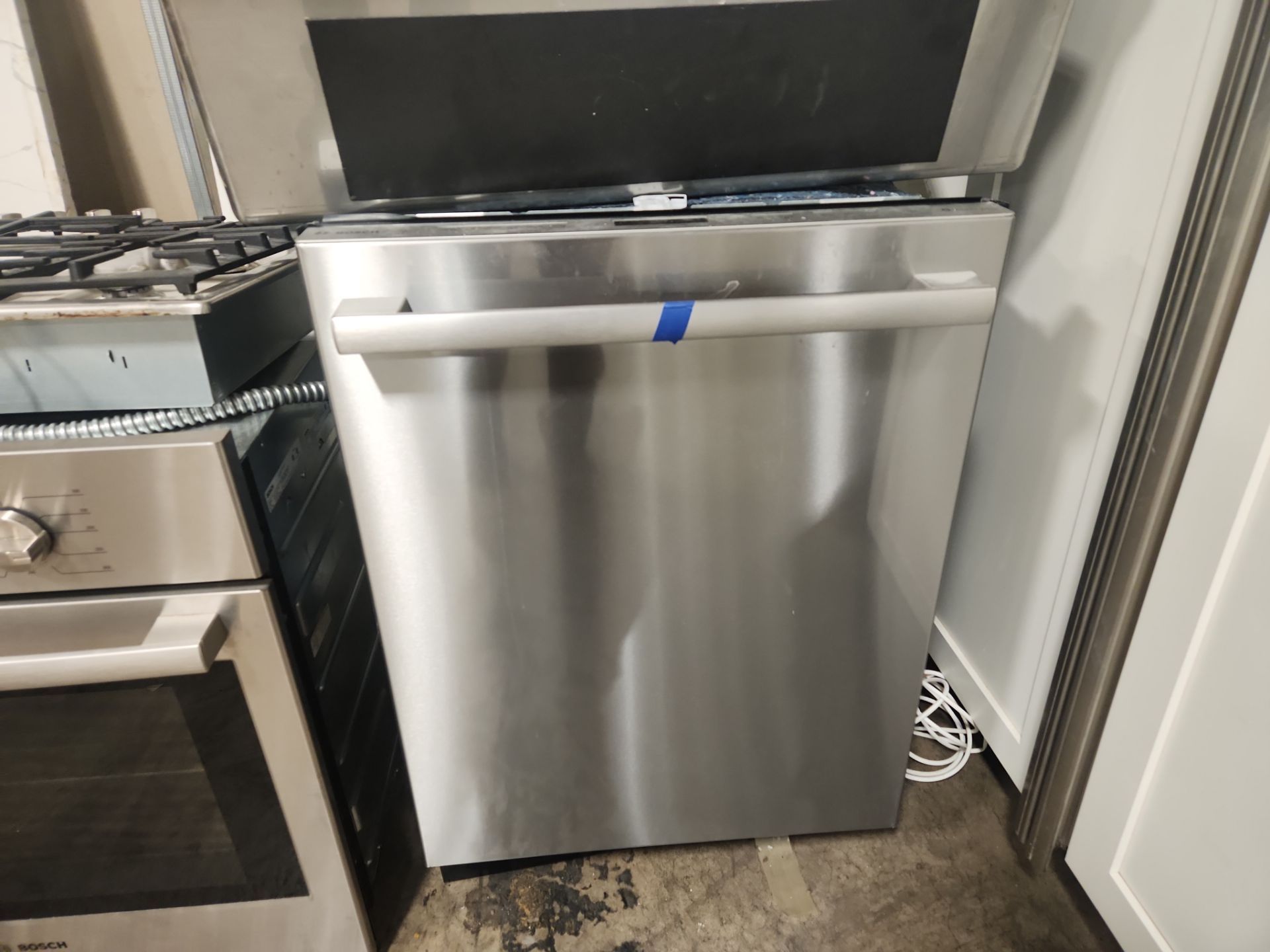 “The Westerly” Transitional White Kitchen with Island, 48" Sub-Zero Refrigerator and Bosch Appliances