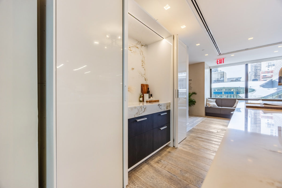 SieMatic S2 Modern Rose Gold Handleless Island with Lotus White Hideaway Pantry | photo 10