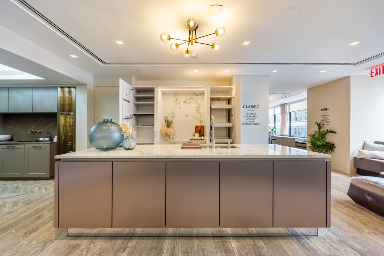 SieMatic Modern Rose Gold Handleless Island with Lotus White Hideaway Pantry with Pocket Doors