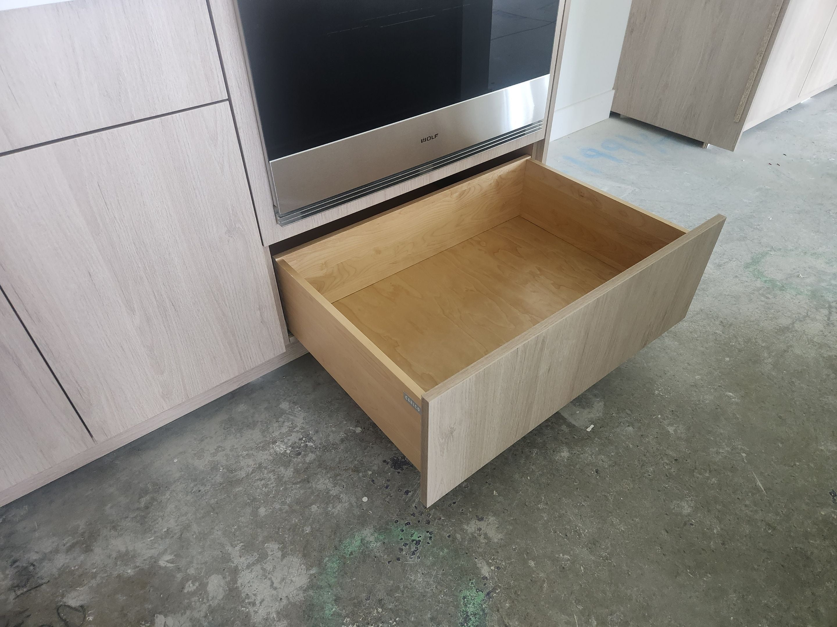 Cabico Sandy Oak Transitional Kitchen with Island & Wolf Appliances