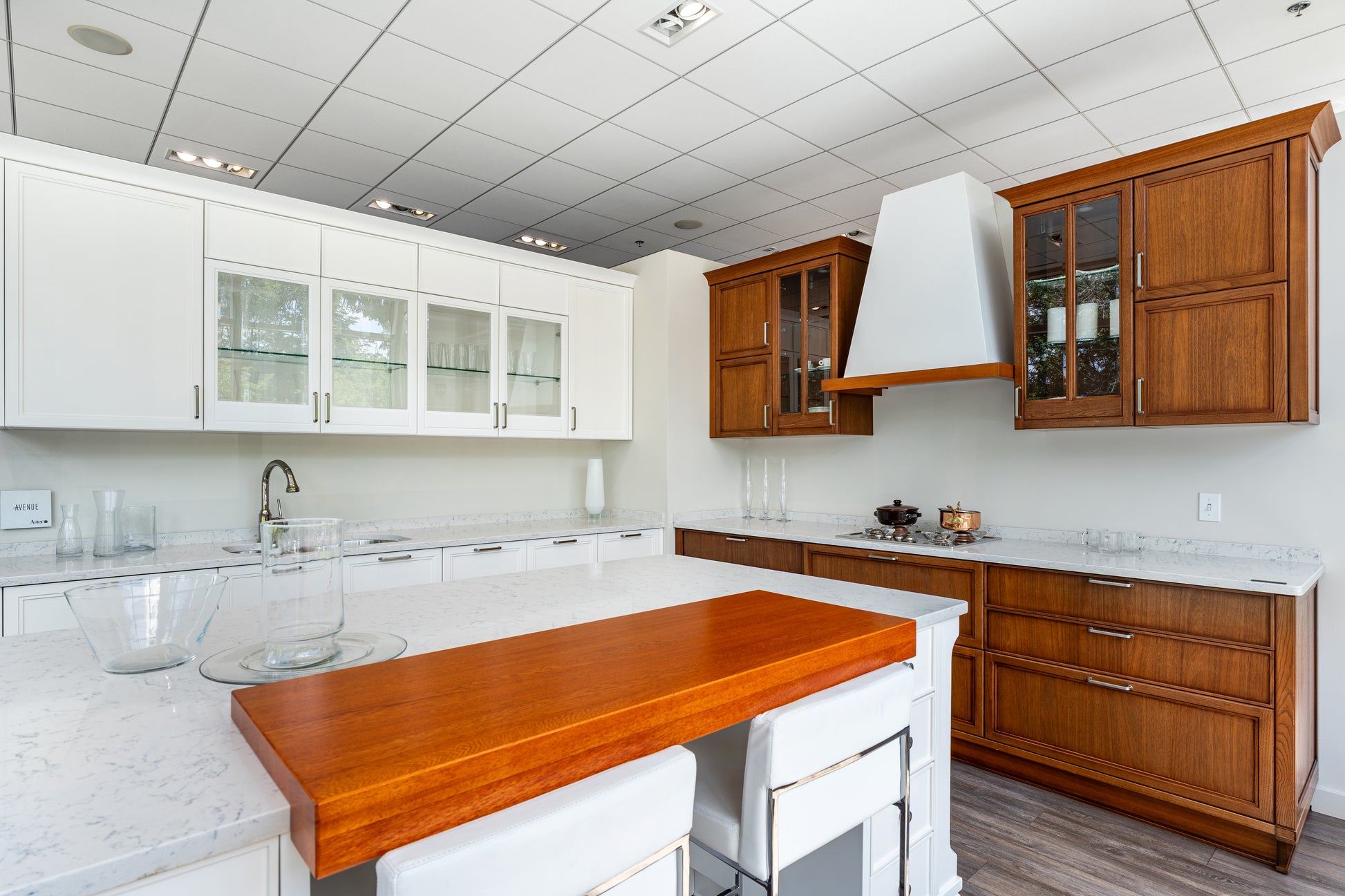 The Aster Aster Cucine transitional white wood kitchen custom cabinetry with large central island front view