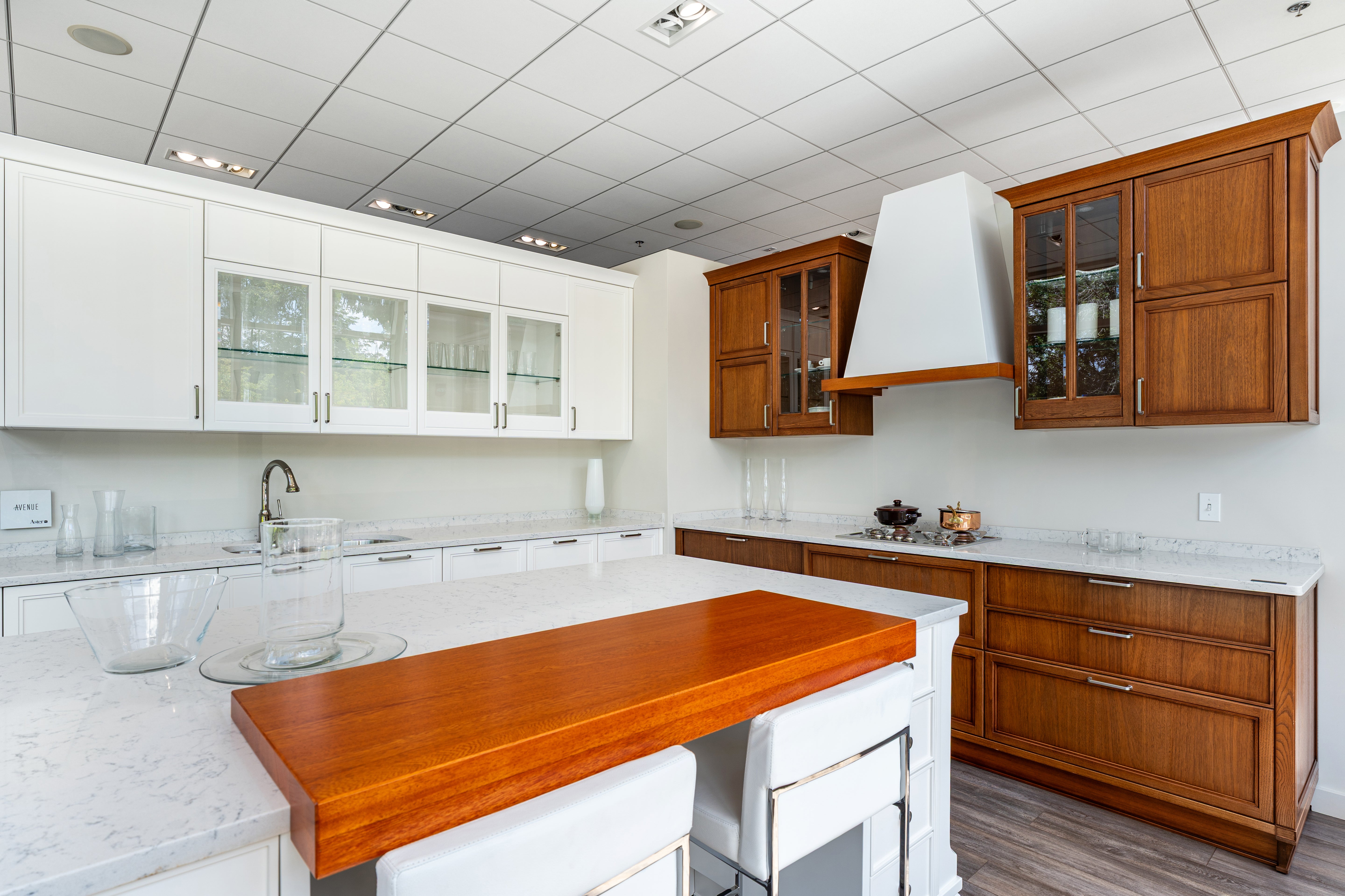 The Aster Aster Cucine transitional white wood kitchen custom cabinetry with large central island front view