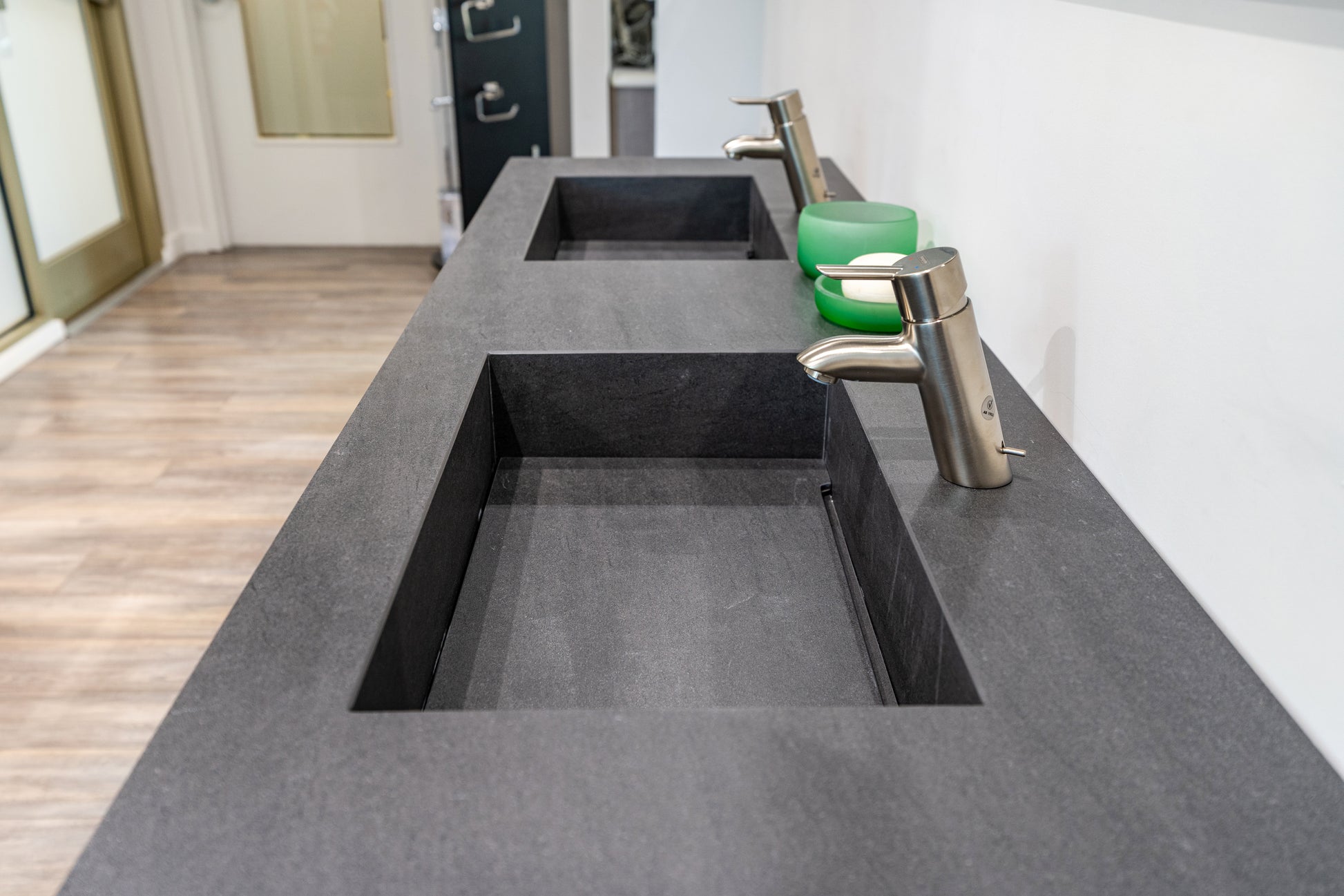 55 inch floating grey bathroom vanity with a single-piece glass integrated double basin countertop layout