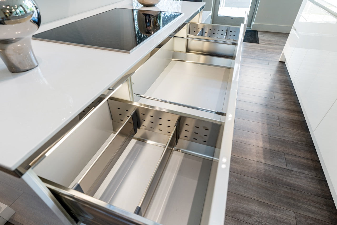 Luxury custom Italian handleless kitchen package showing mirror gloss white lacquer doors and deep base drawers open