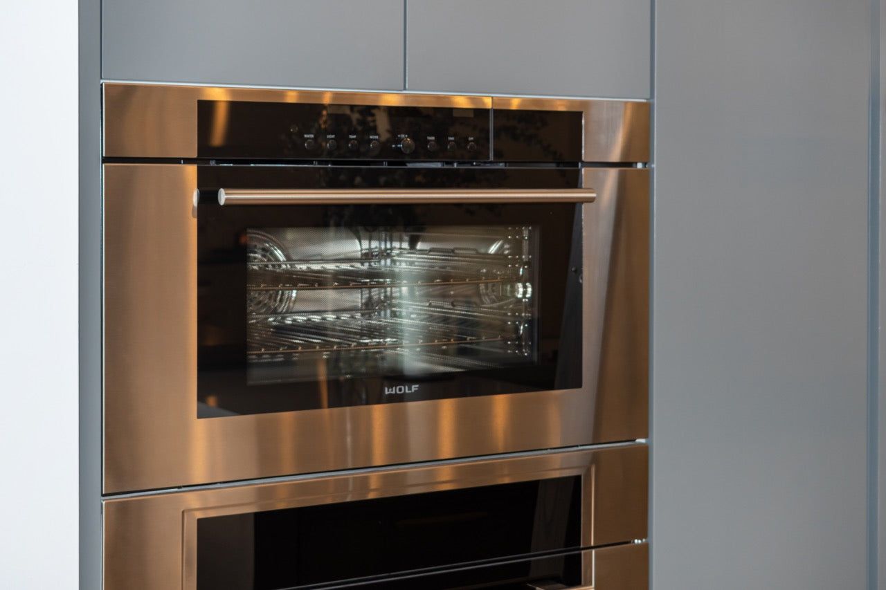 Modern Matte Gray Kitchen with Rift Cut White Oak Island and Wolf & Sub-Zero Appliances