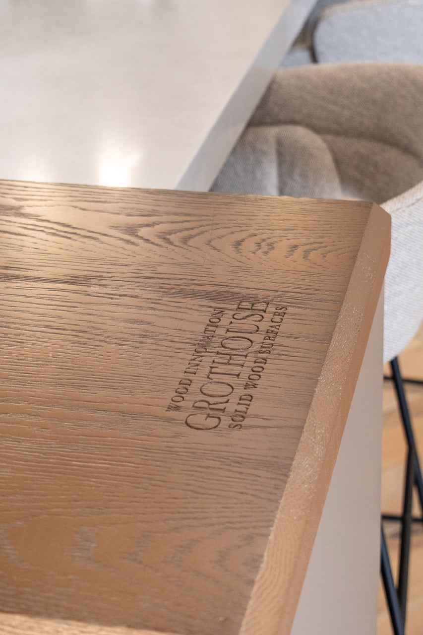 Modern Matte Gray Kitchen with Rift Cut White Oak Island and Wolf & Sub-Zero Appliances