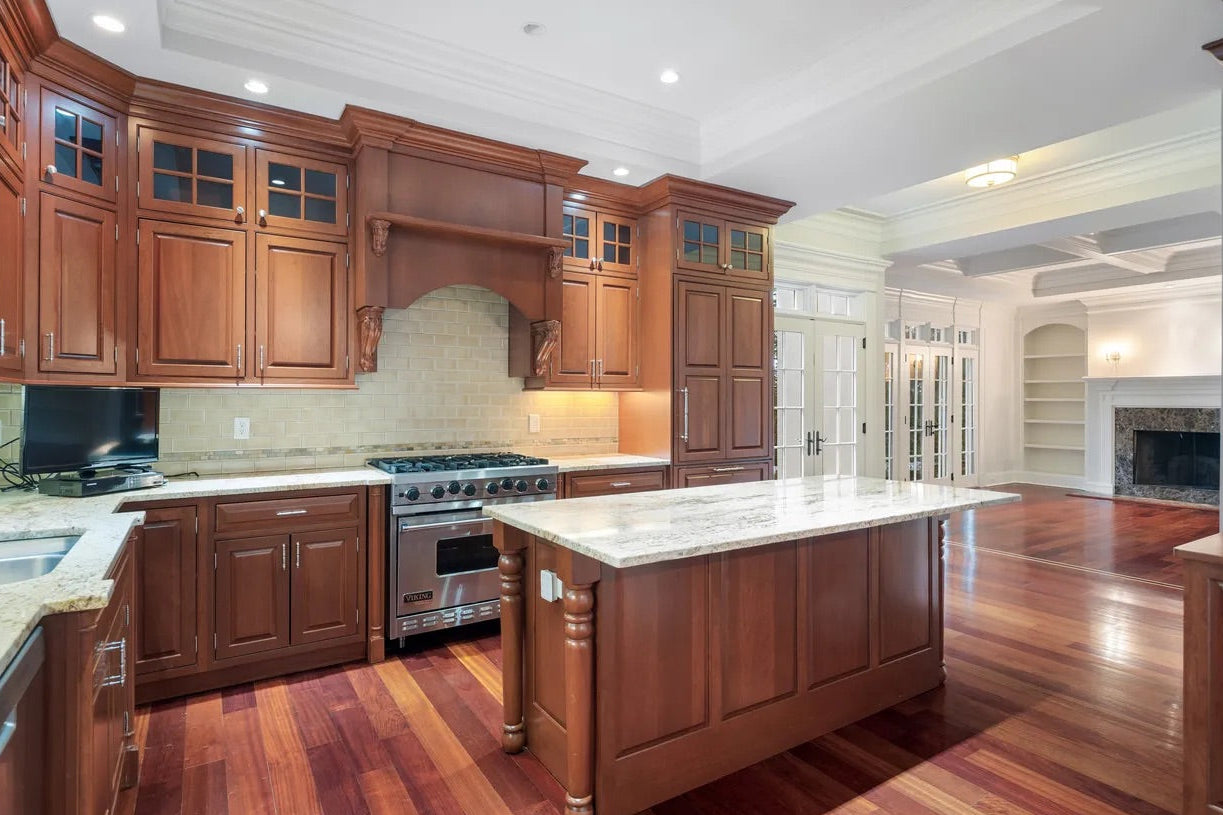 Luxury pre-owned wood kitchen set configured for Viking range and Sub-Zero refrigerator