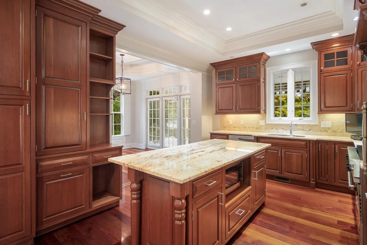 Custom Plain and Fancy wood cabinets with soft close dovetail drawers and crown molding
