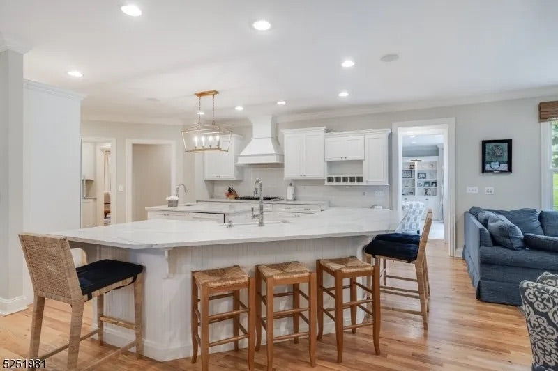 Pre owned white estate kitchen package featuring shaker doors and large central work island