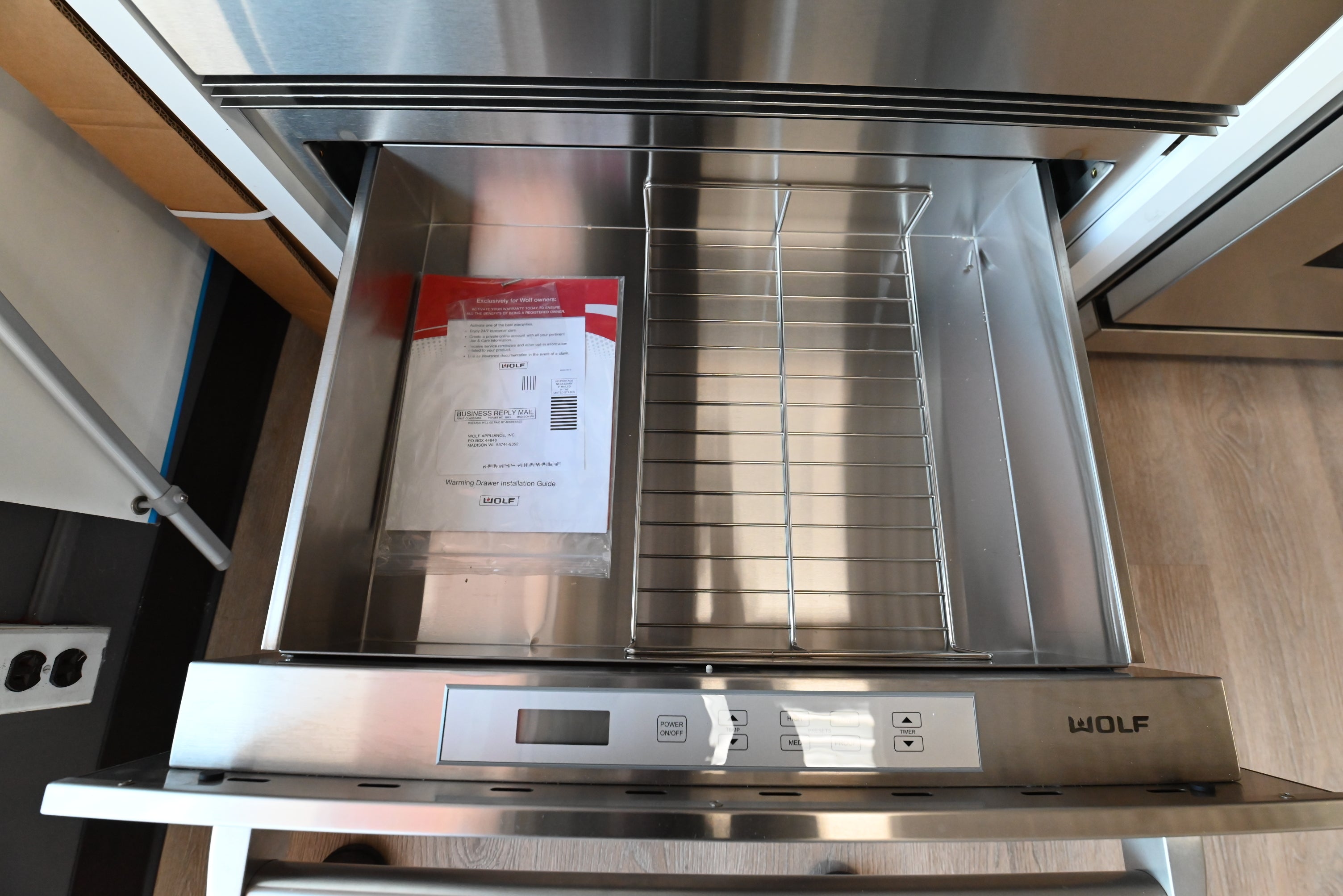 Luxury 30 inch built in undercounter warming drawer by Wolf with professional bar handle