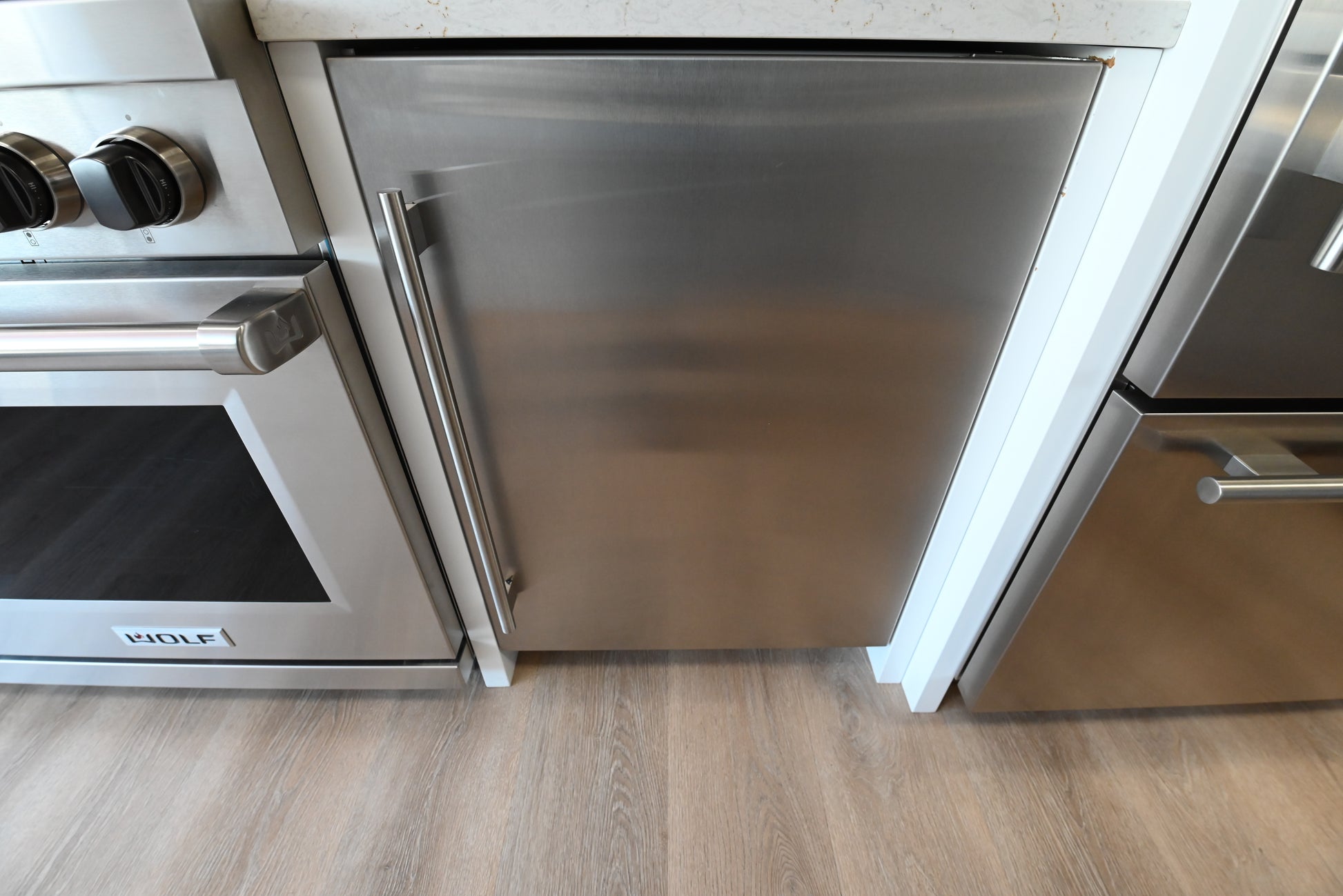 Sub Zero DEU2450CI 24 inch undercounter combination refrigerator freezer with stainless steel panel door view