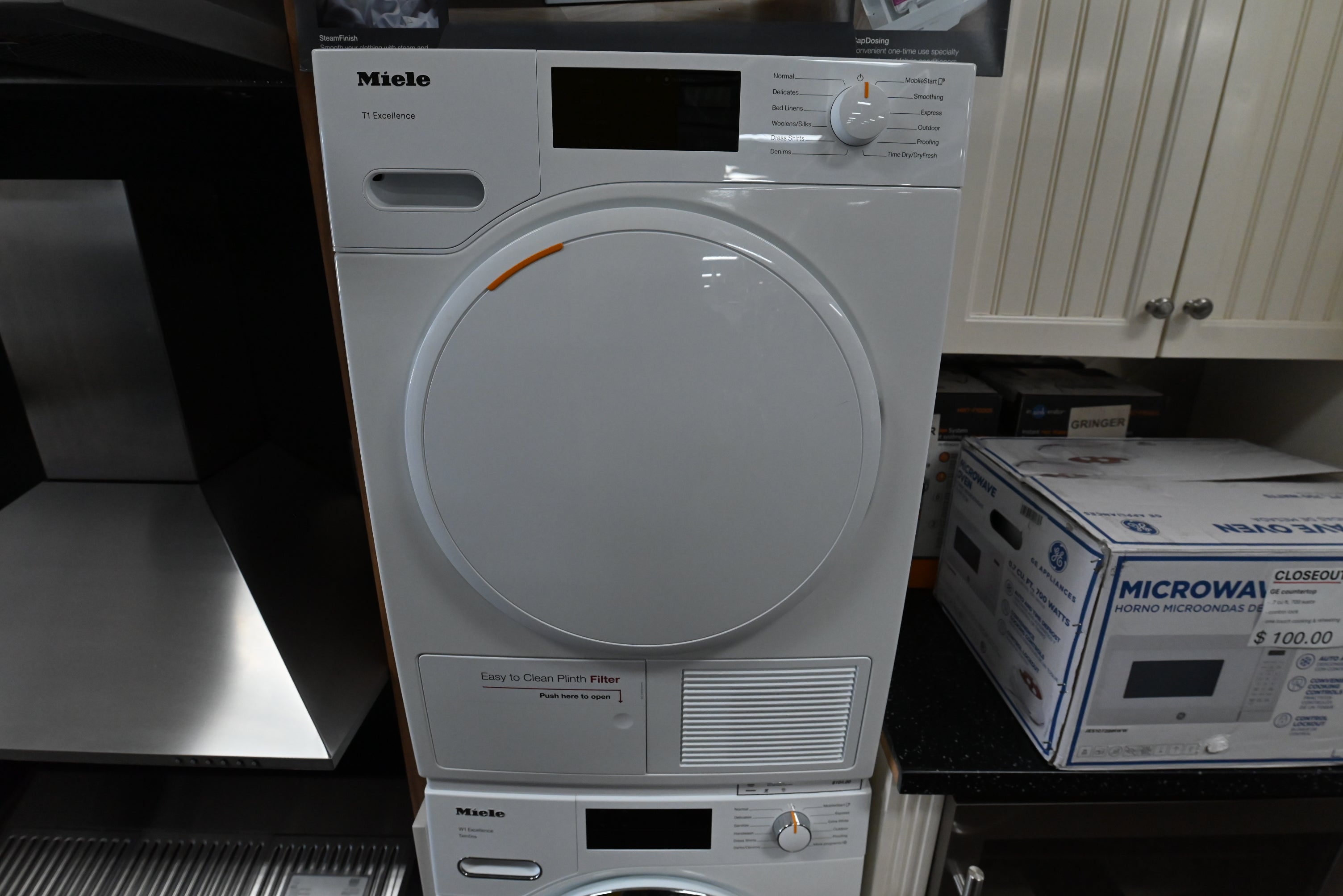 Miele T1 TXD160WP compact 24 inch ventless heat pump dryer front view lotus white