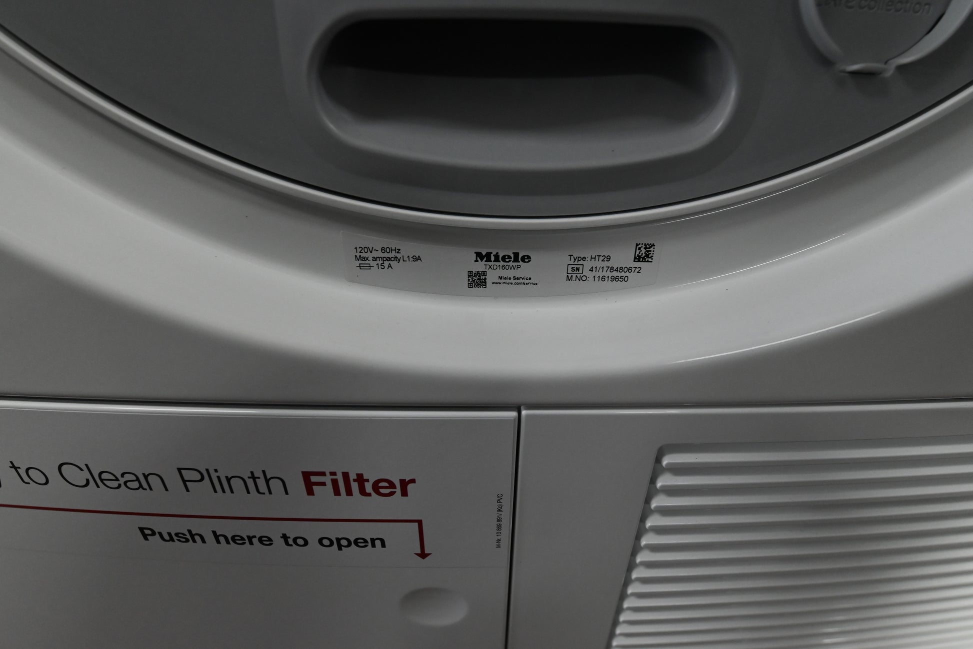 Miele TXD160WP compact ventless dryer showing top left condensation water collection drawer