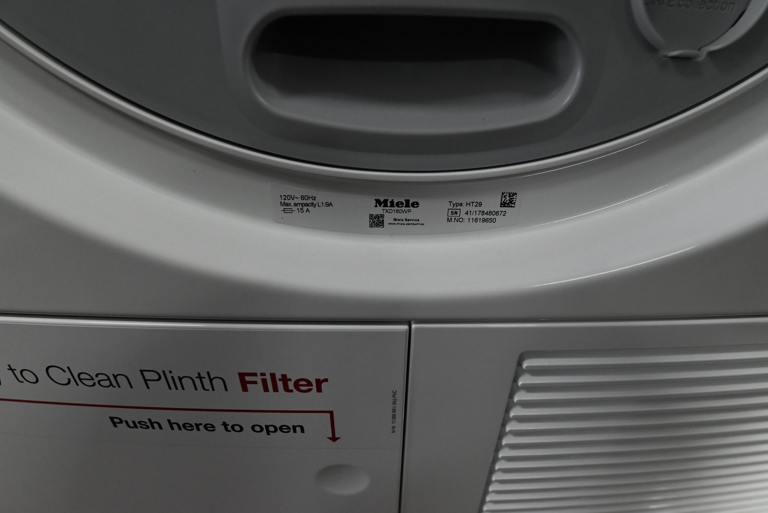 Miele TXD160WP compact ventless dryer showing top left condensation water collection drawer