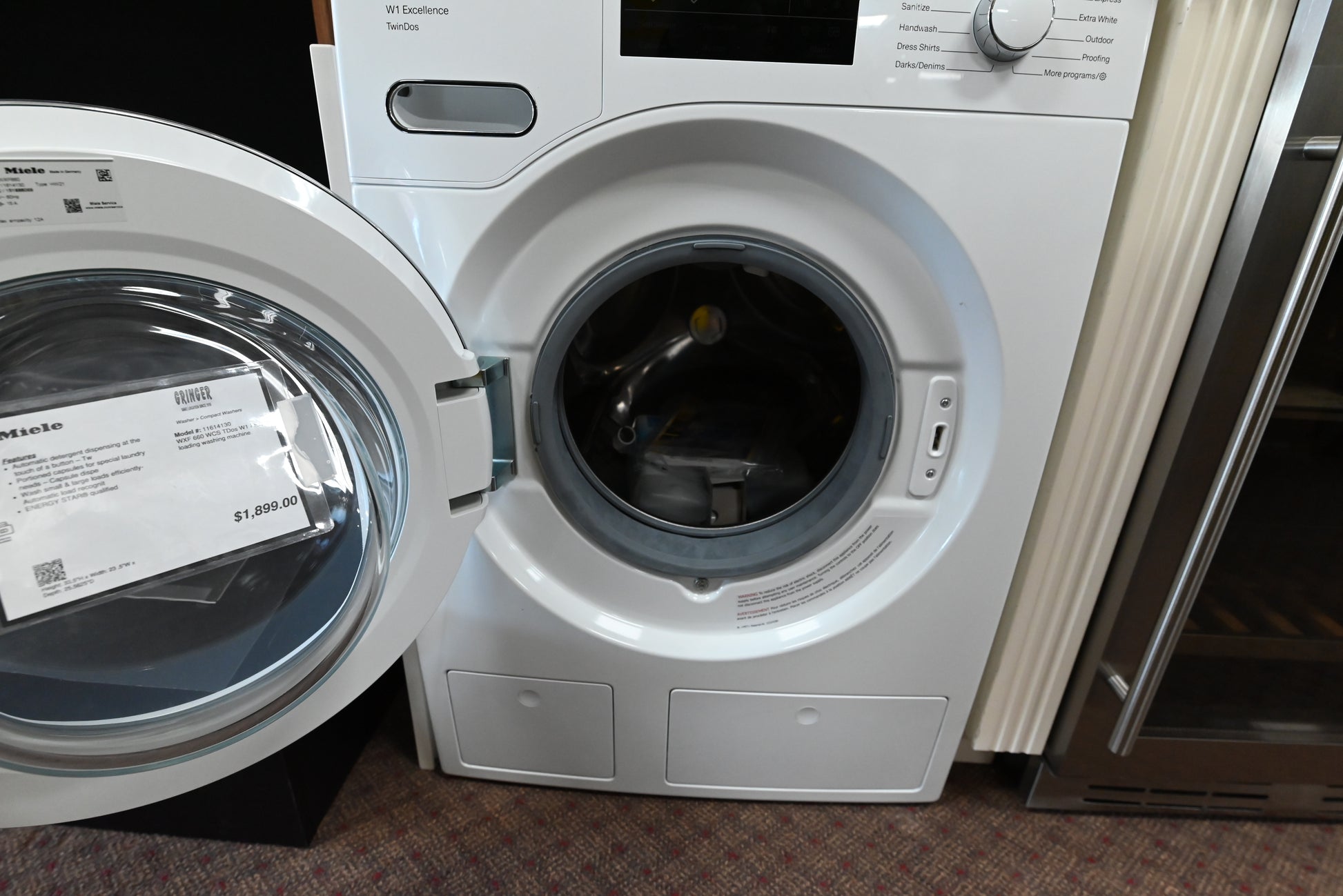 Luxury German engineered compact washer showing open chrome door and internal stainless honeycomb drum