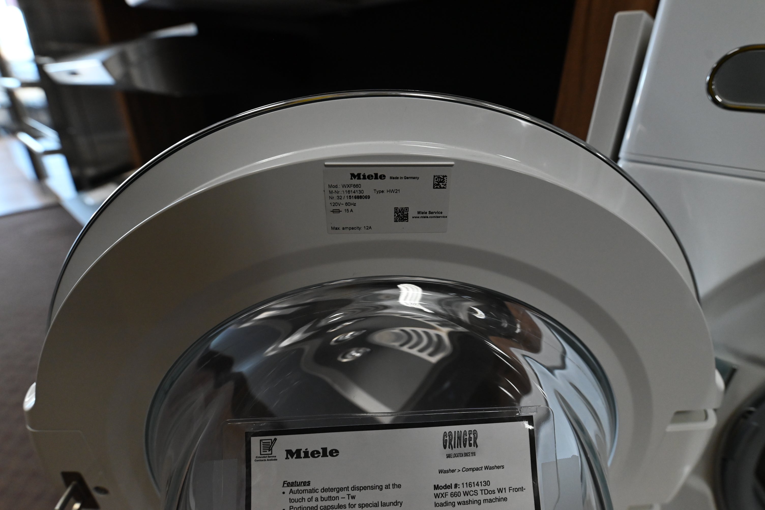 Miele WXF660 front load washer showing TwinDos automatic detergent drawer bays