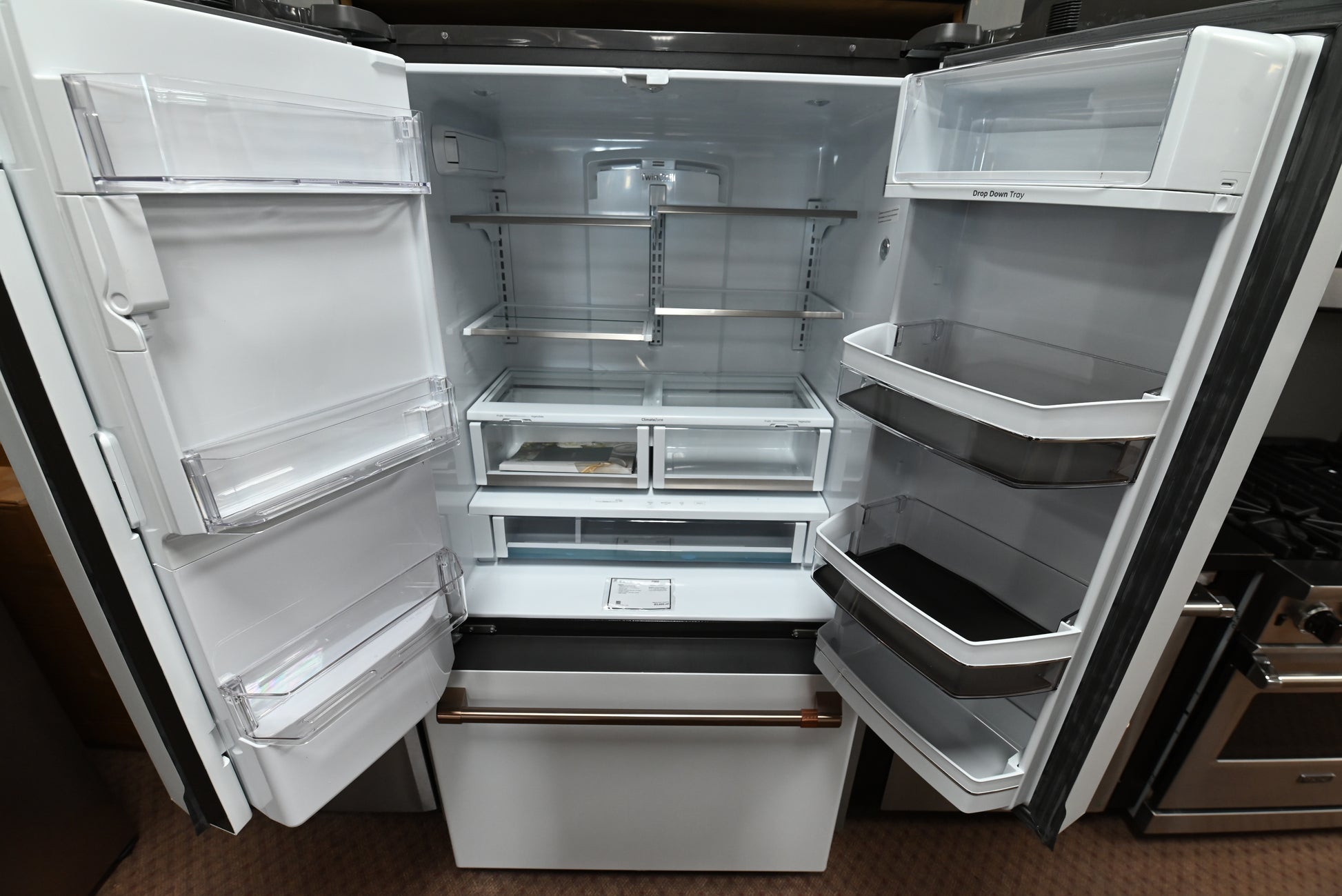 Luxury 36 inch smart counter depth refrigerator with hot water dispenser and brushed bronze handles by Cafe