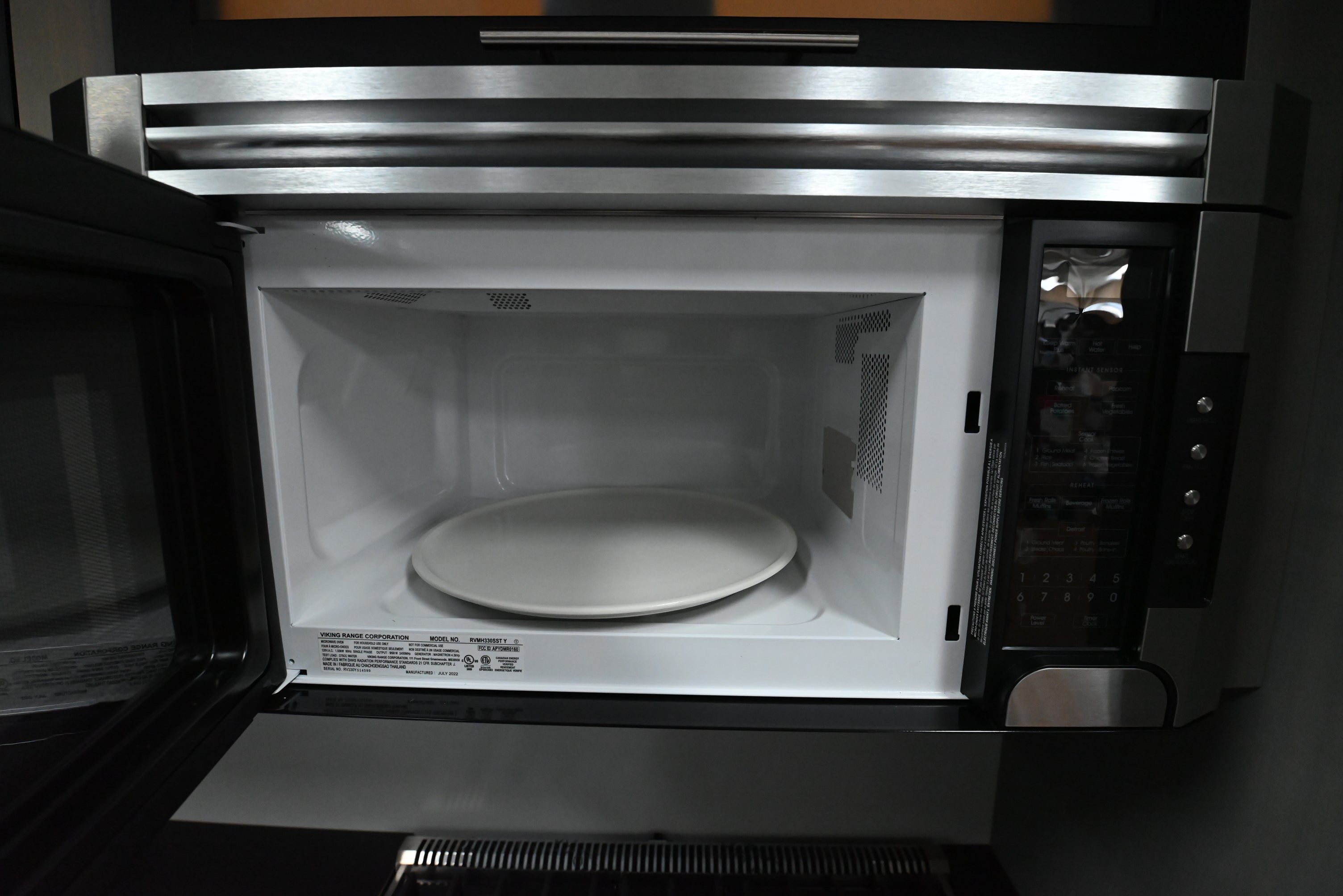 Luxury 30 inch over the range microwave showing pro style stainless handle and right touch control pad