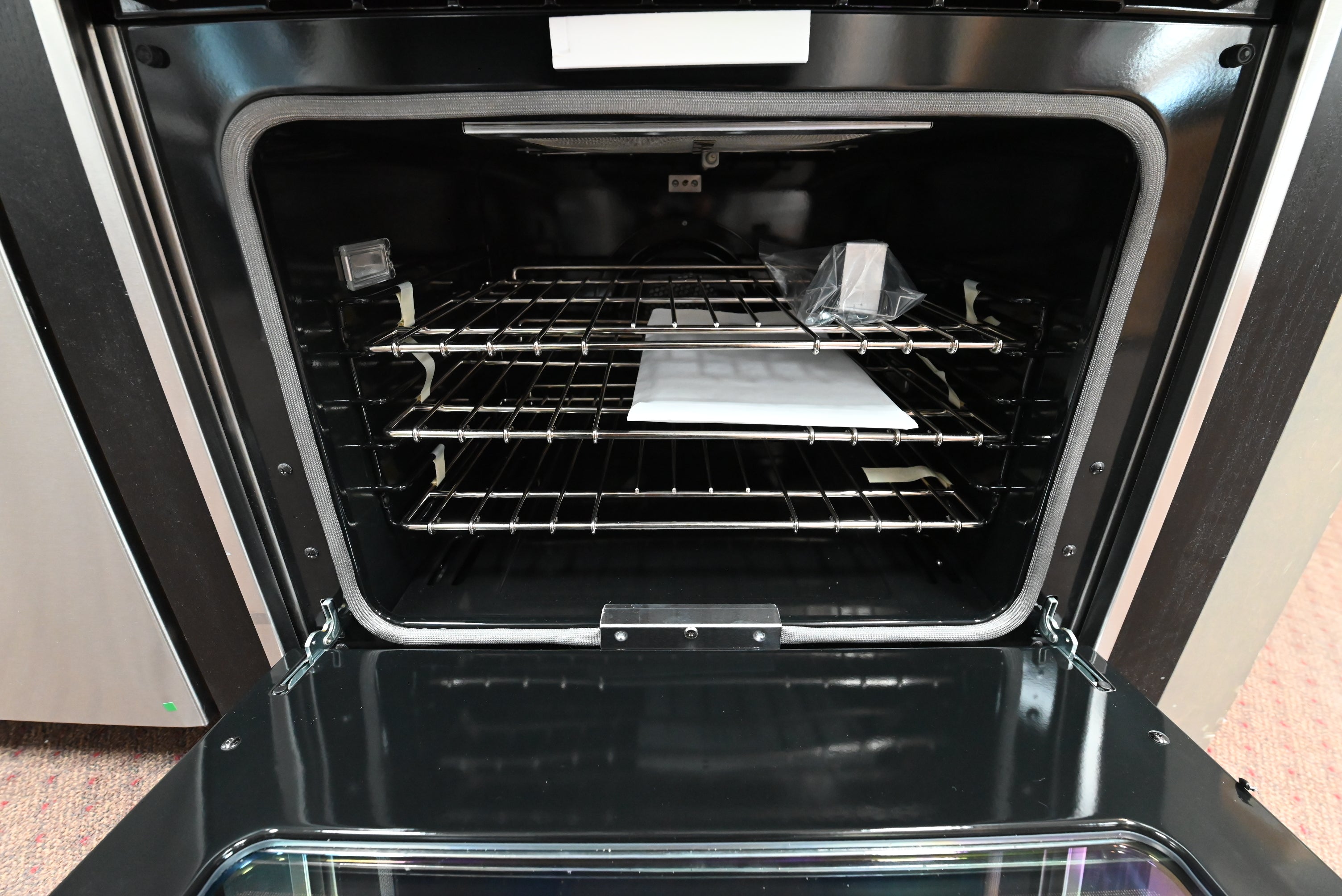 Viking 30 professional range showing full width removable grease drip pan tray extended