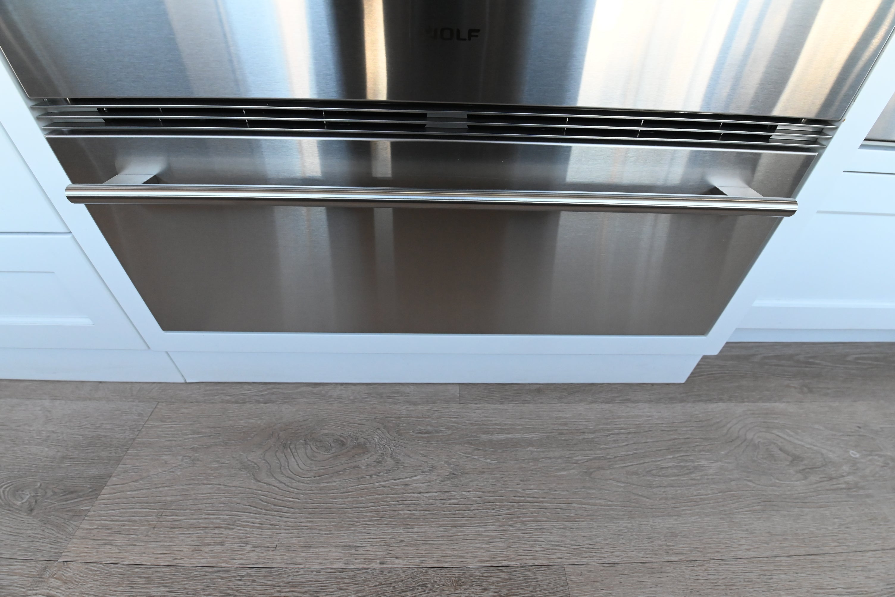 Wolf WWD30 30 inch warming drawer with attached stainless panel front view