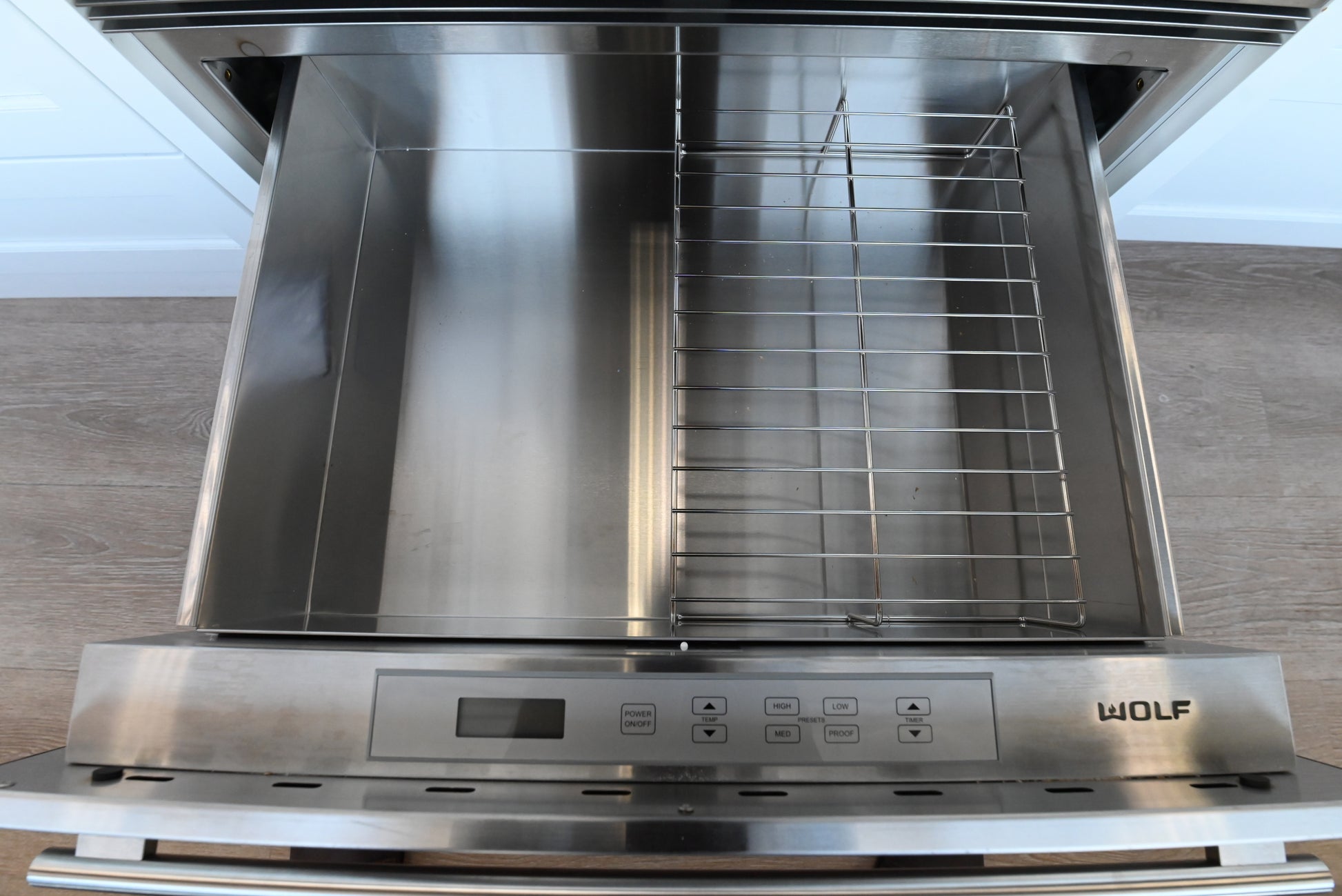 Luxury 30 inch integrated warming drawer by Wolf with professional handle
