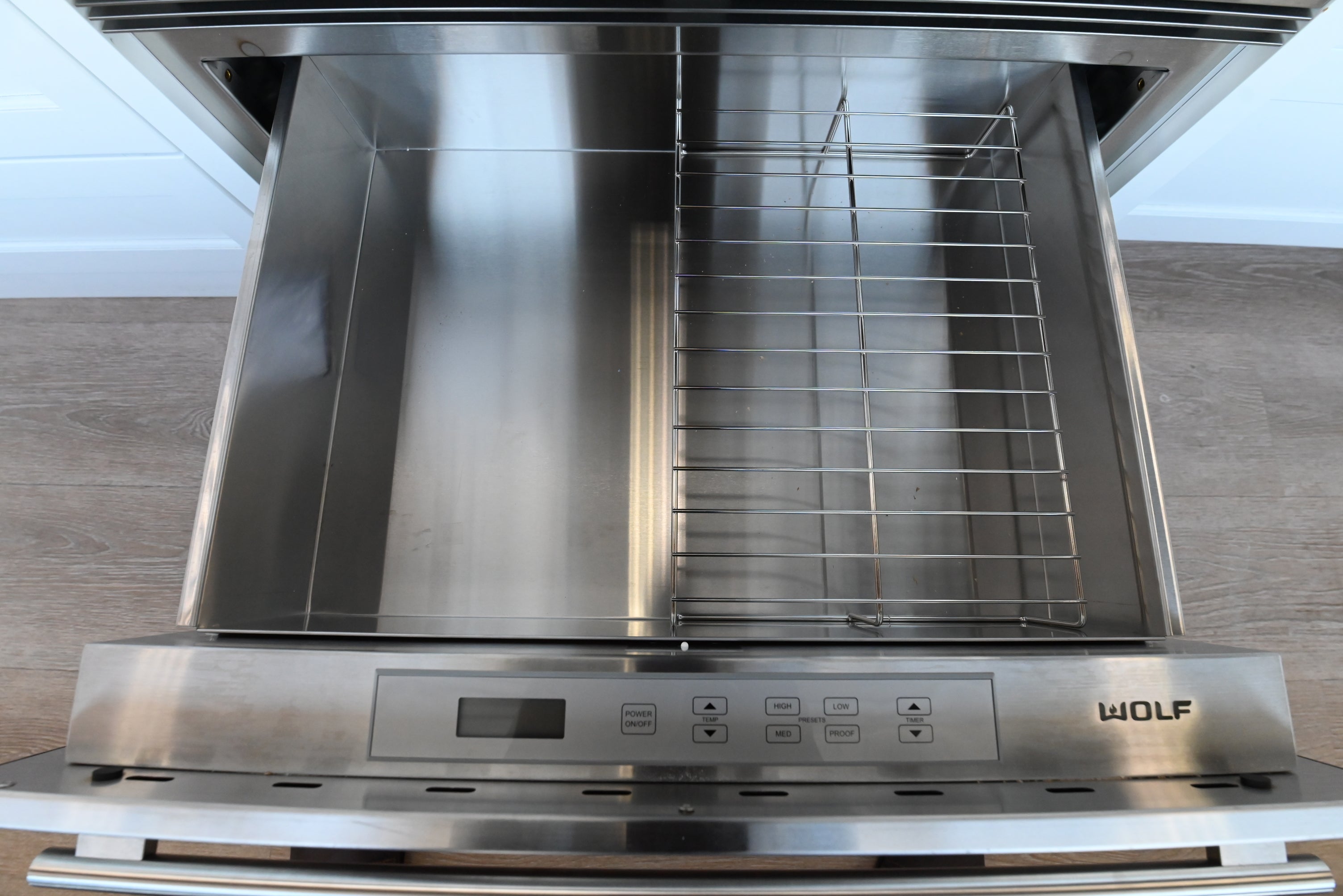 Luxury 30 inch integrated warming drawer by Wolf with professional handle