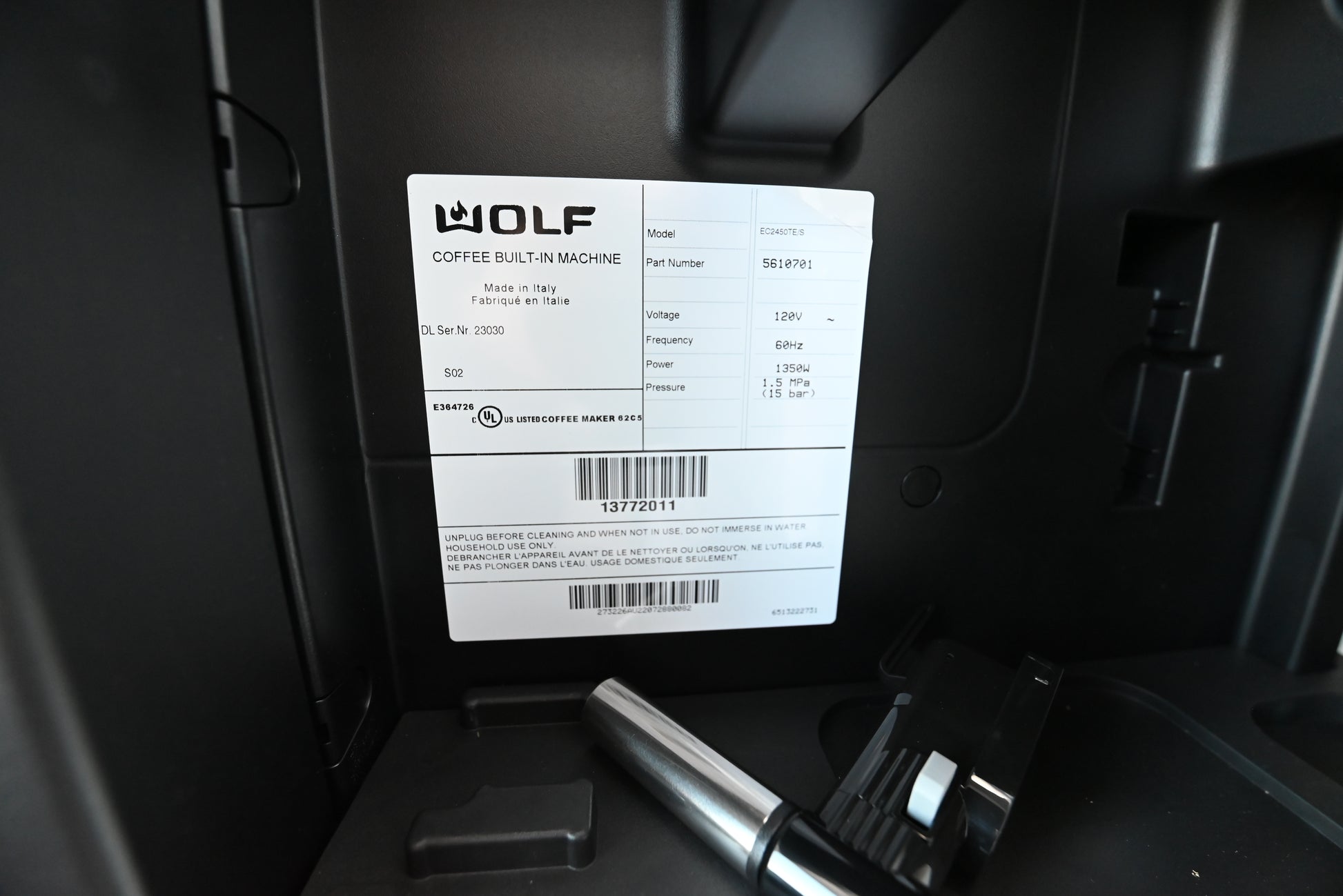 Wolf built in coffee center glided open on cabinet tracks for bean filling