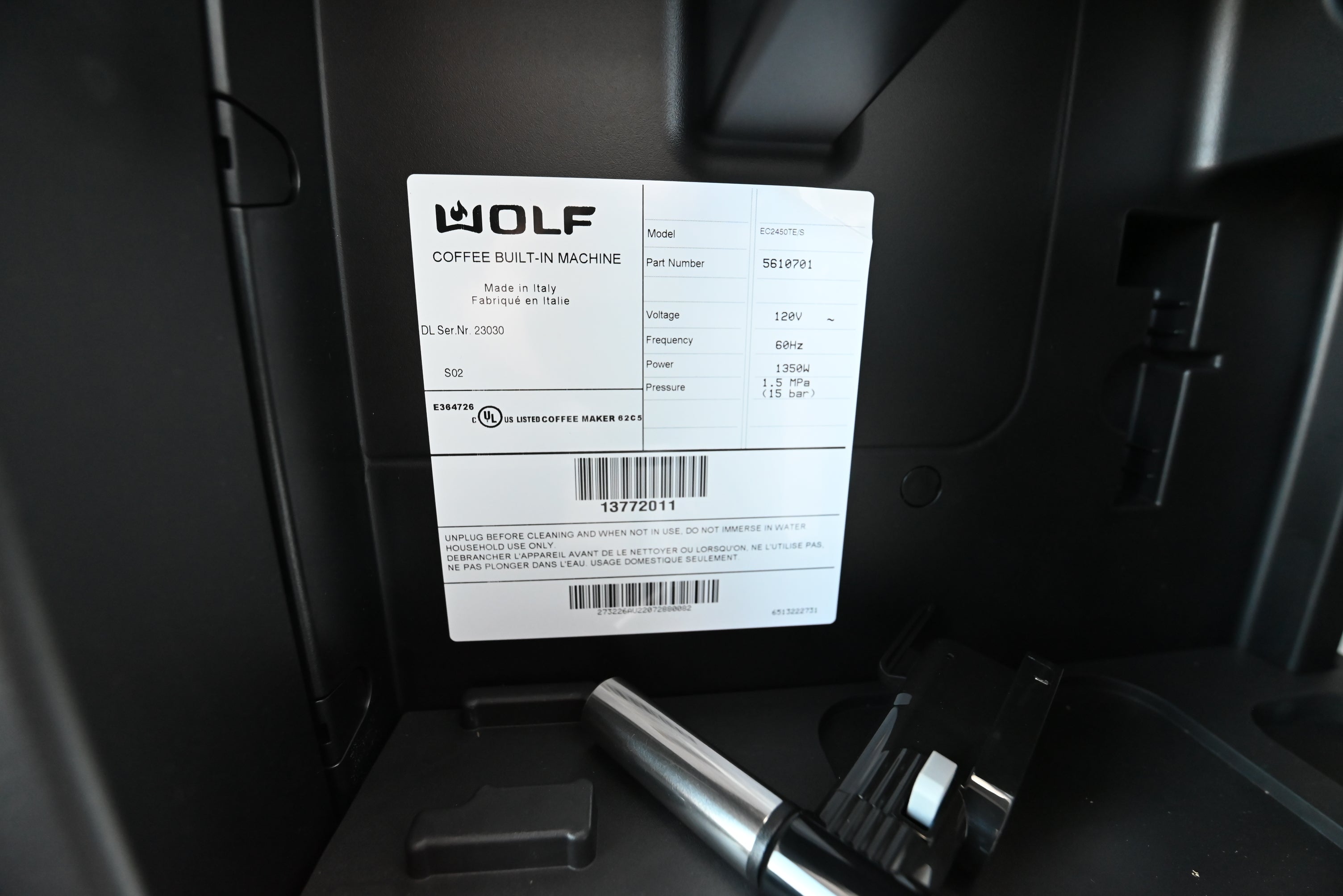 Wolf built in coffee center glided open on cabinet tracks for bean filling