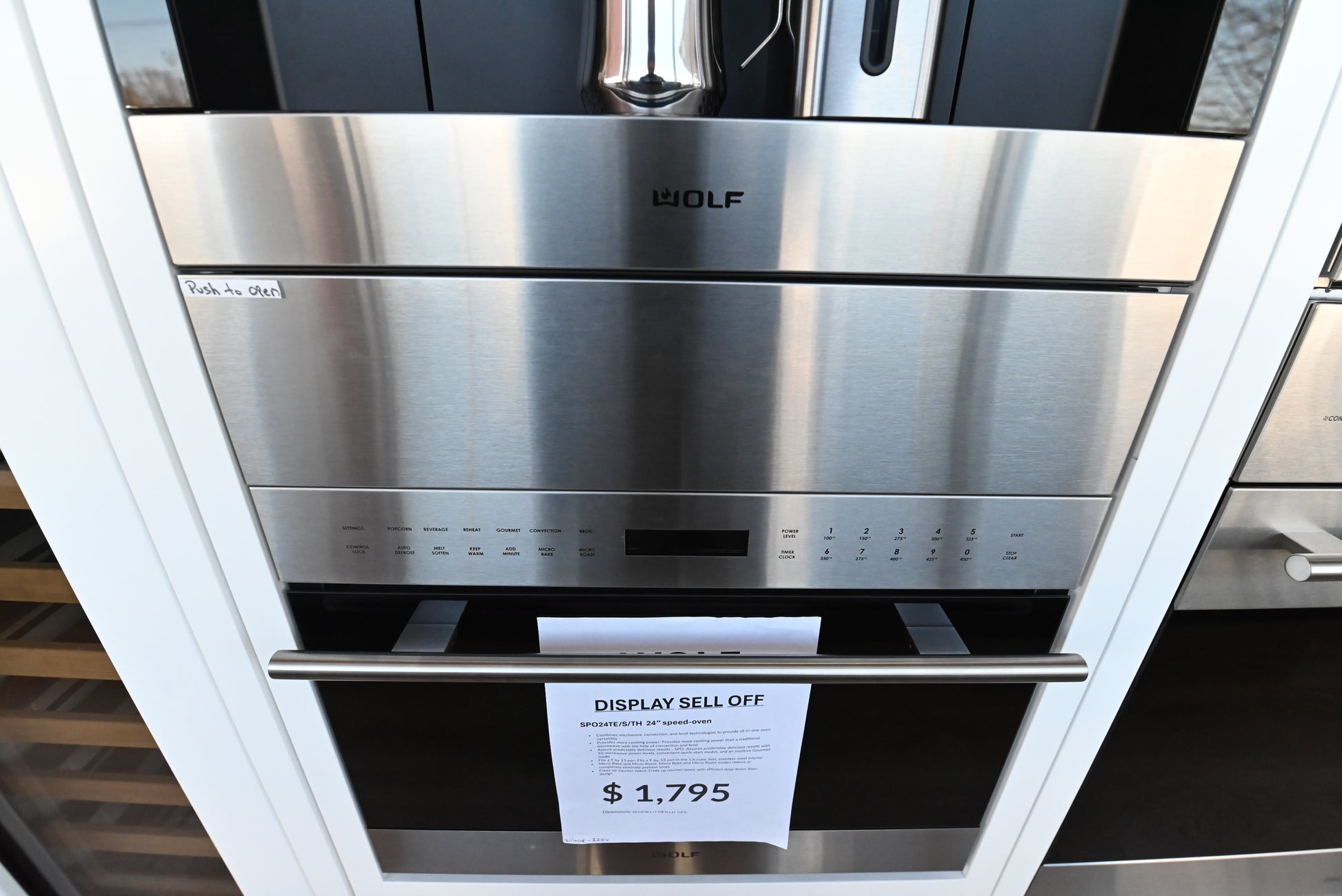 Wolf CW24S 24 inch transitional cup warming drawer front view closed in classic stainless steel
