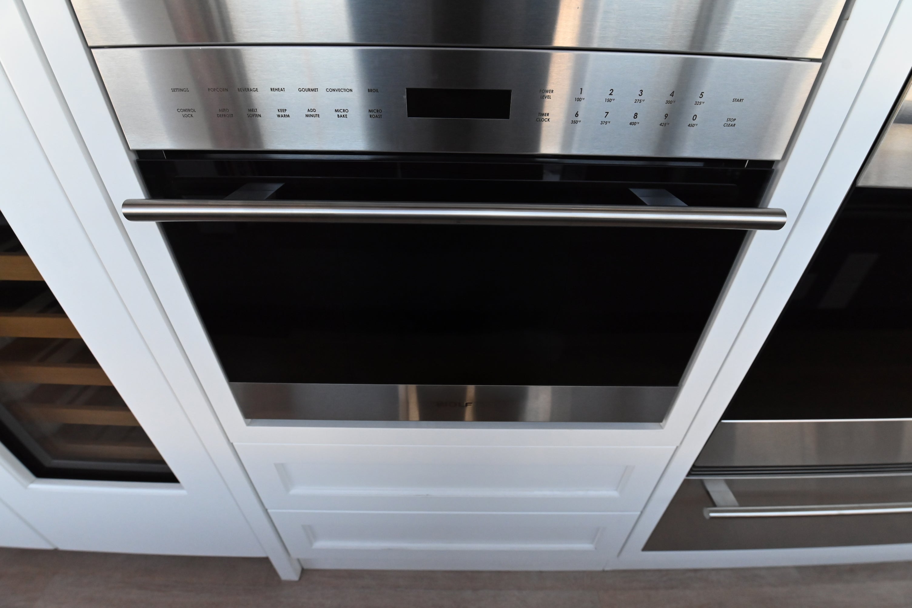 Wolf SPO24TE S TH 24 inch transitional built in speed oven with tubular handle front view