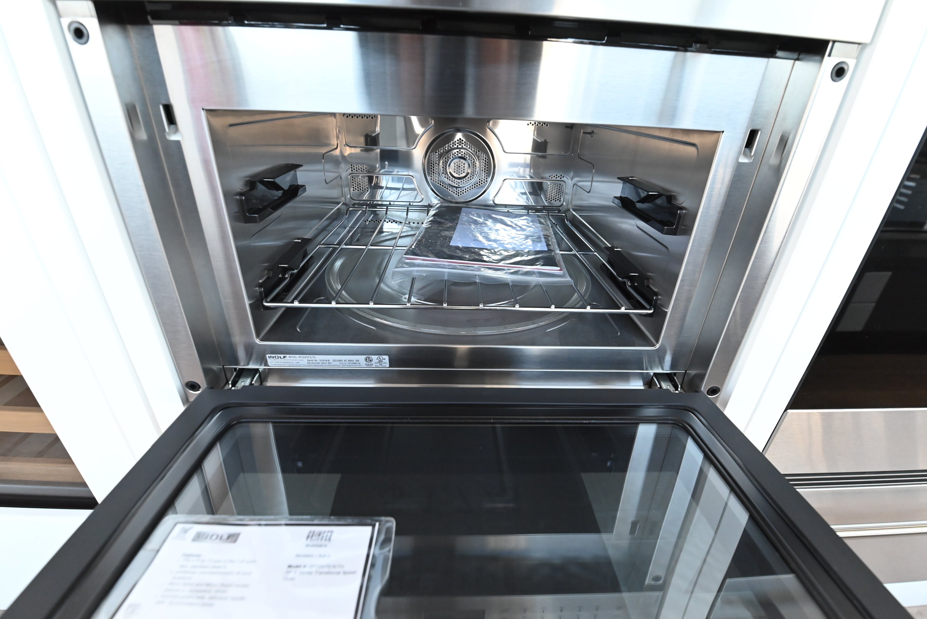 Luxury 24 inch combination microwave convection oven with black glass panel by Wolf