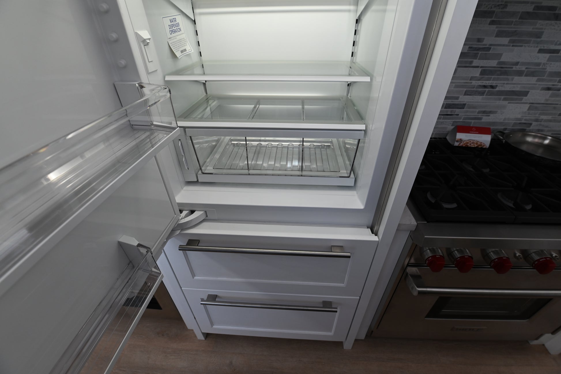 Sub Zero 30 designer refrigerator with lower pull out freezer drawer and automatic ice maker
