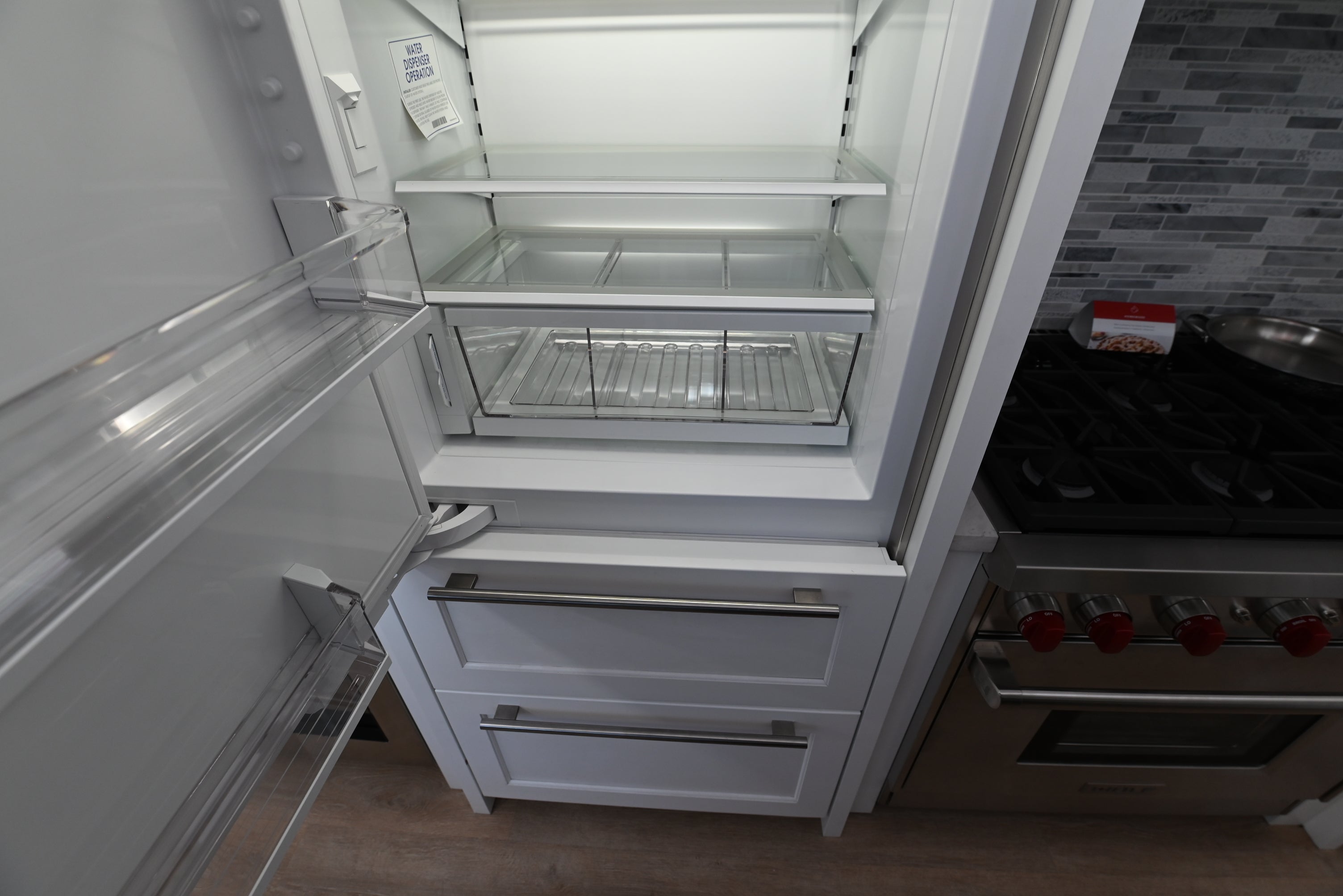 Sub Zero 30 designer refrigerator with lower pull out freezer drawer and automatic ice maker