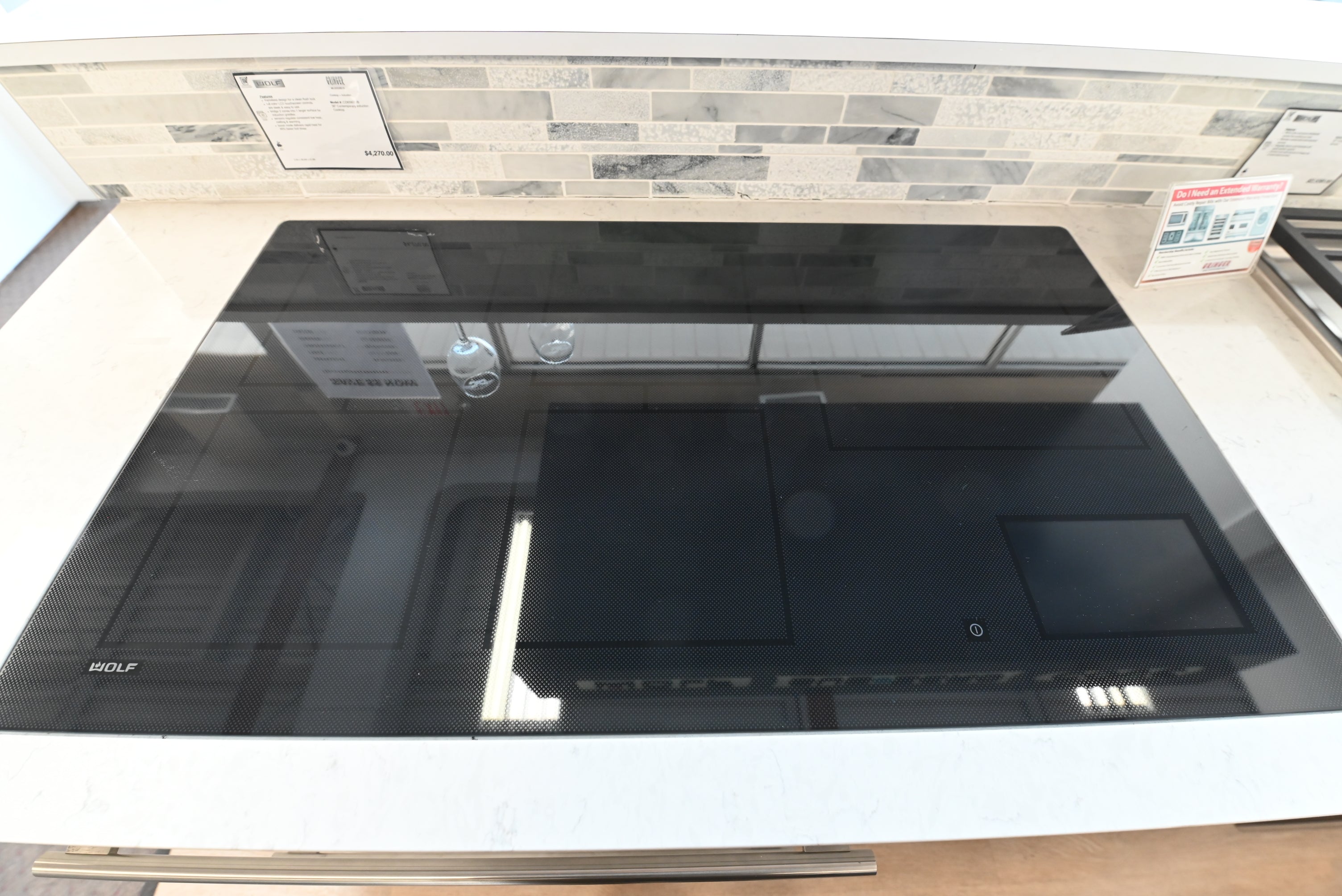 Luxury 36 inch frameless induction cooktop with 5 cooking zones and touch controls by Wolf