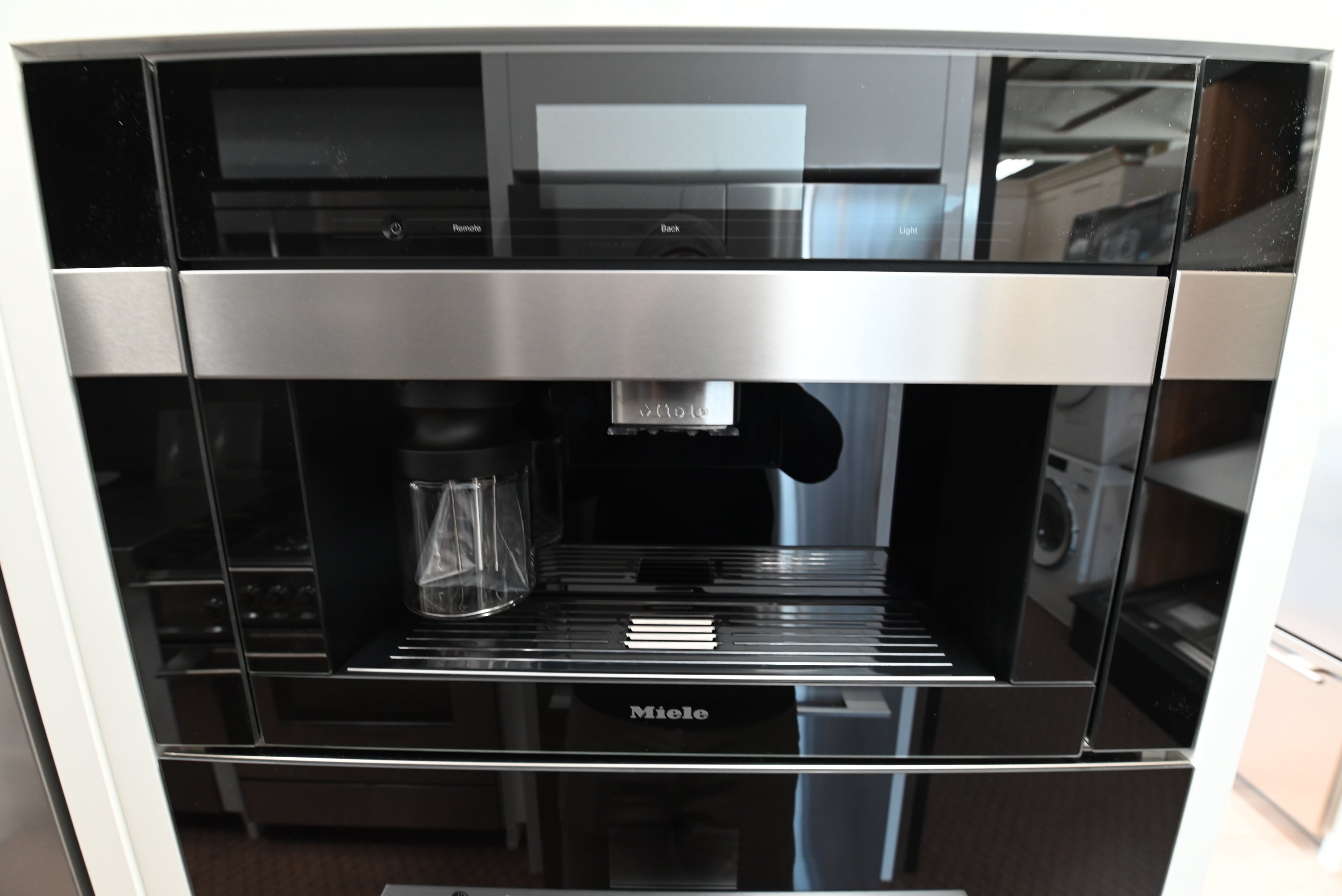 Miele CVA 7845 24 inch built in plumbed coffee machine front view in clean touch steel