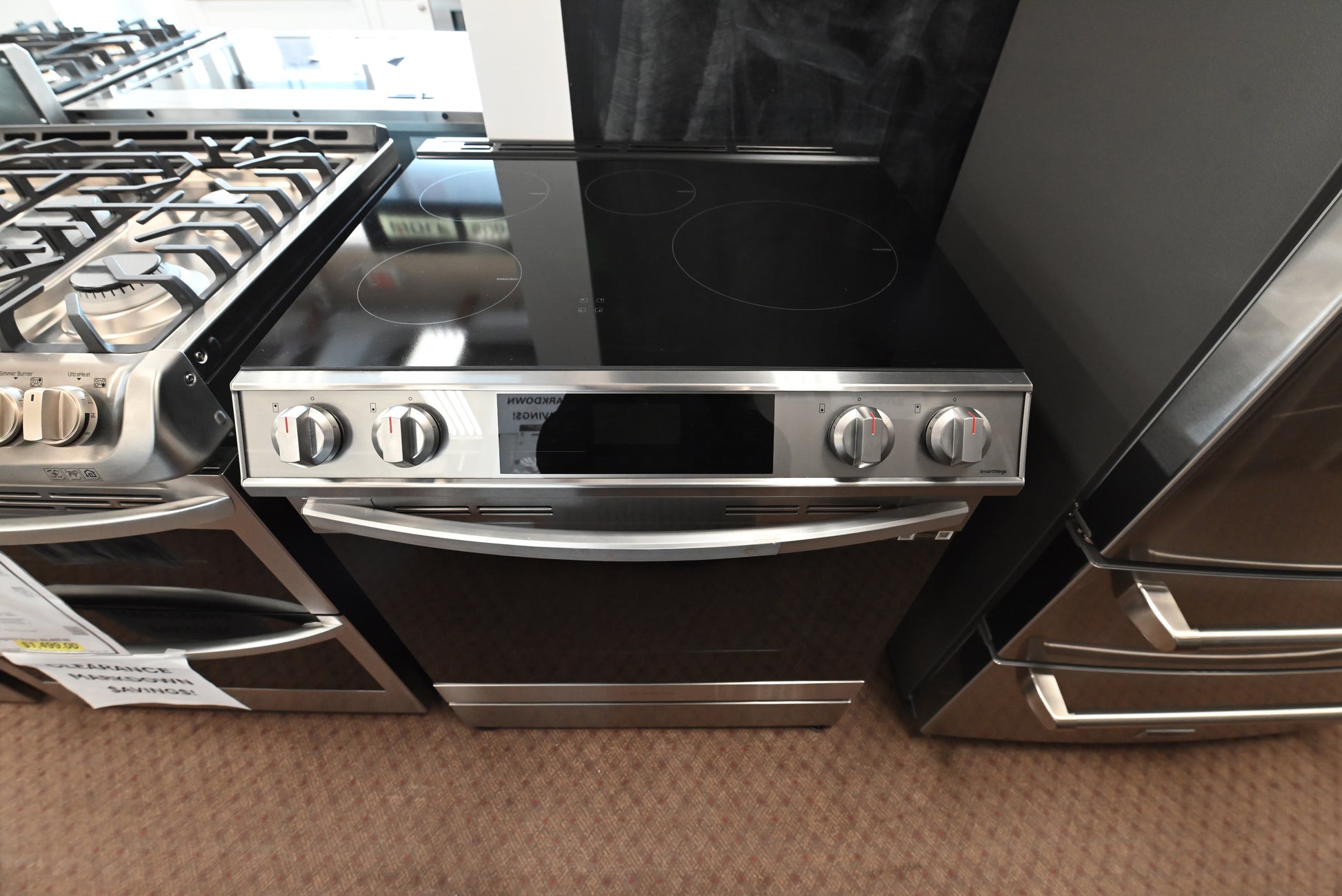 Close up of Samsung Bespoke induction cooktop elements and front control panel