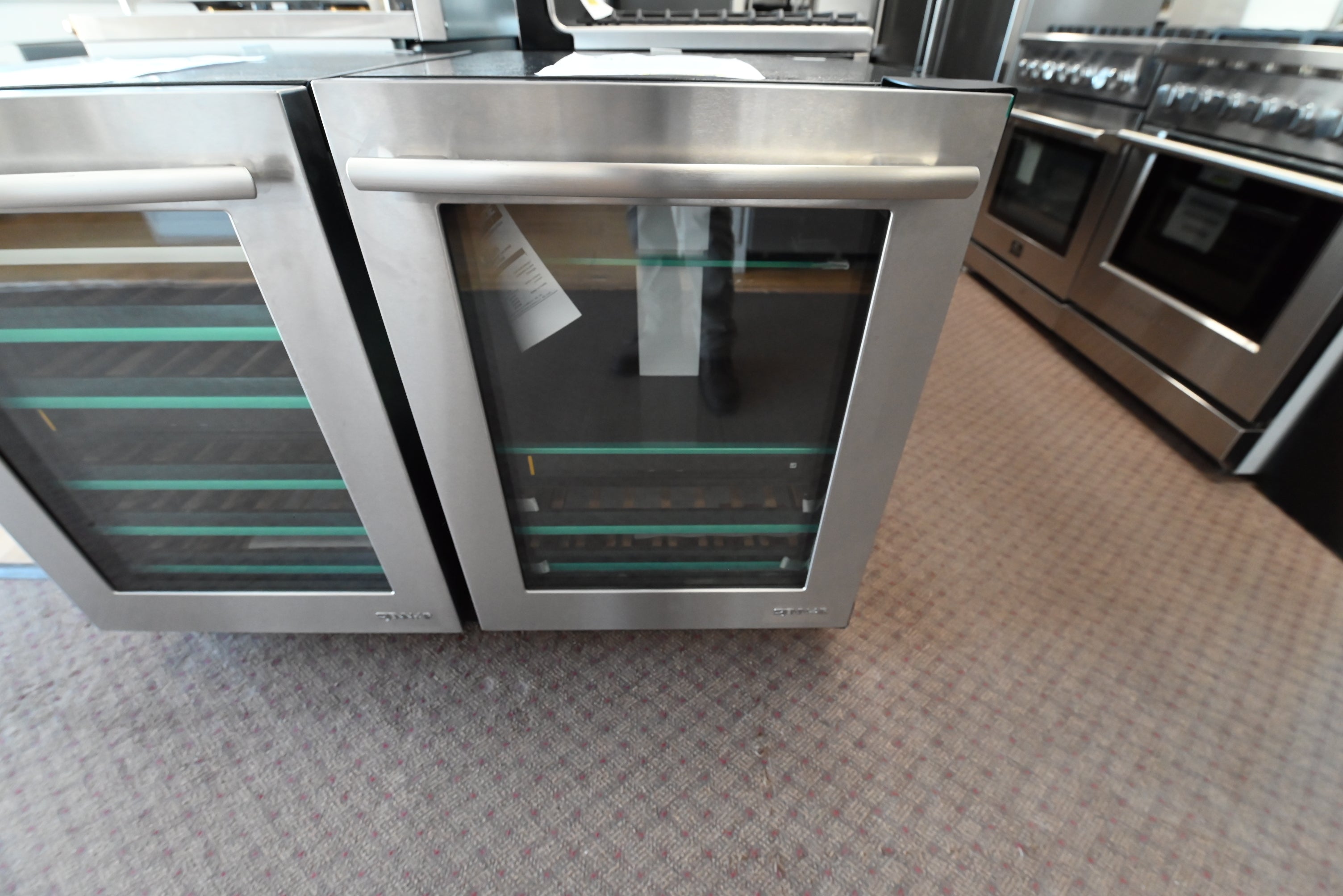 JennAir JUB24FRERS 24 inch built in undercounter beverage center with right hinge stainless steel glass door front view
