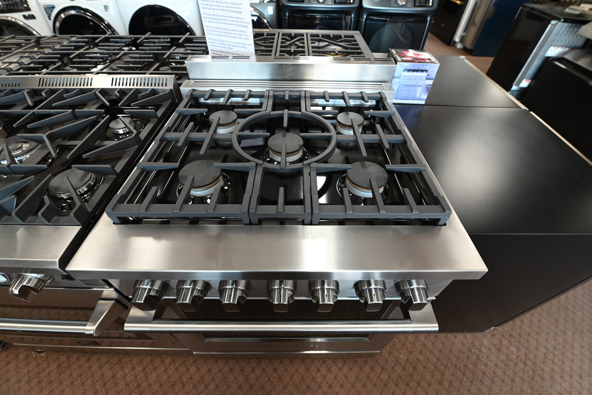 Fisher & Paykel pro-style gas range with continuous cast iron grates and halo dials