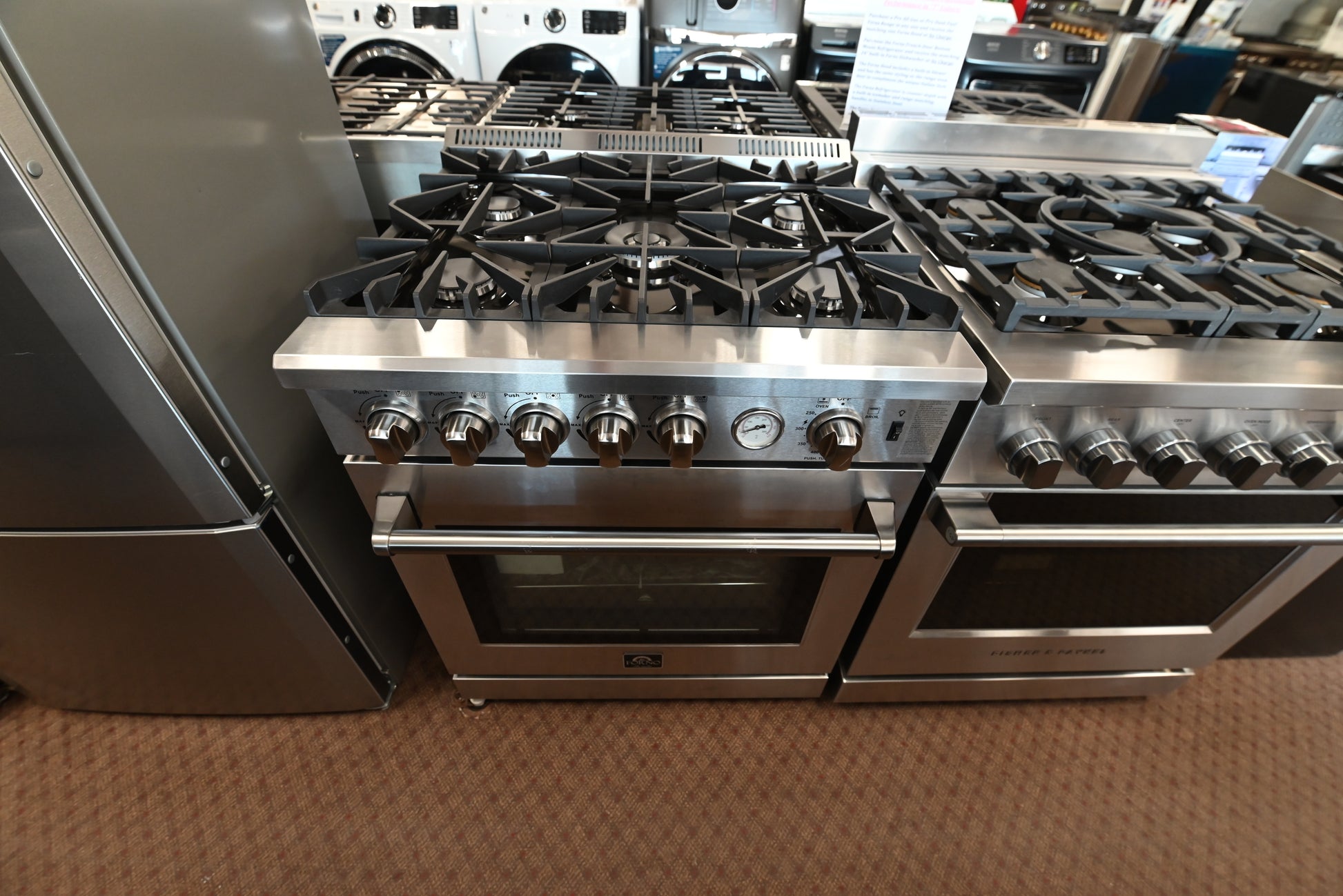 Forno pro-style gas range with continuous cast iron grates and metal knobs