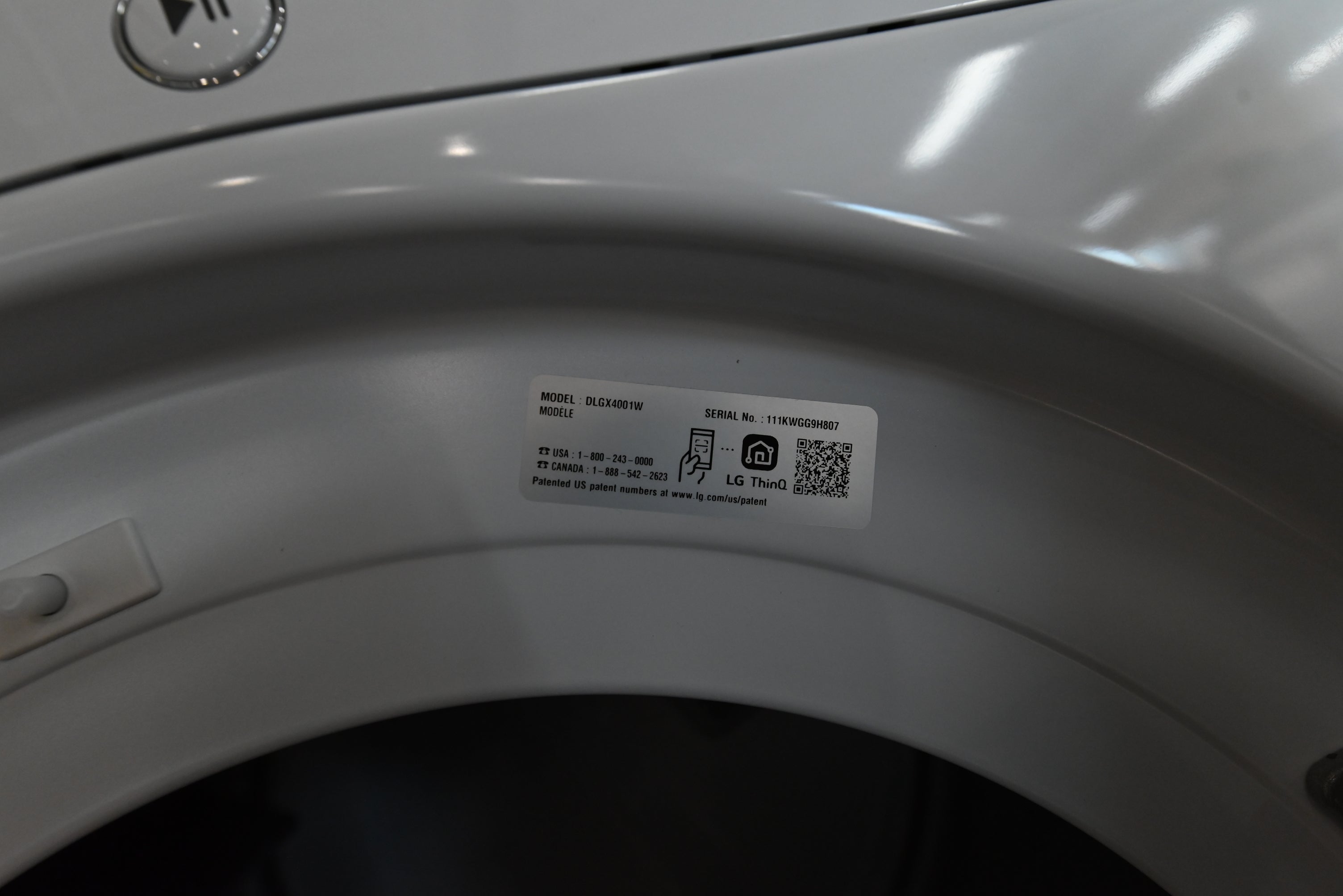 Luxury 27 inch front load gas dryer showing clear tempered glass door and interior aluminized steel drum