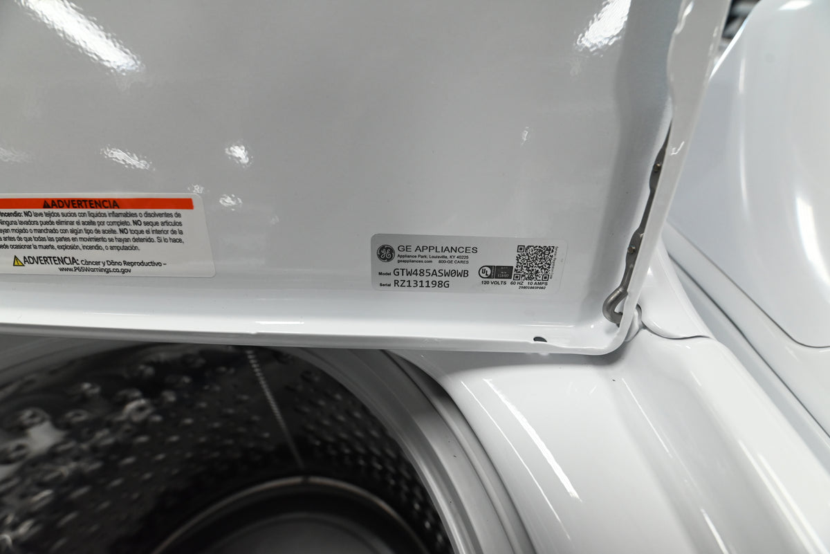 Detail view of the Wash Boost Cold Plus and Deep Fill control dials on the GE white washer