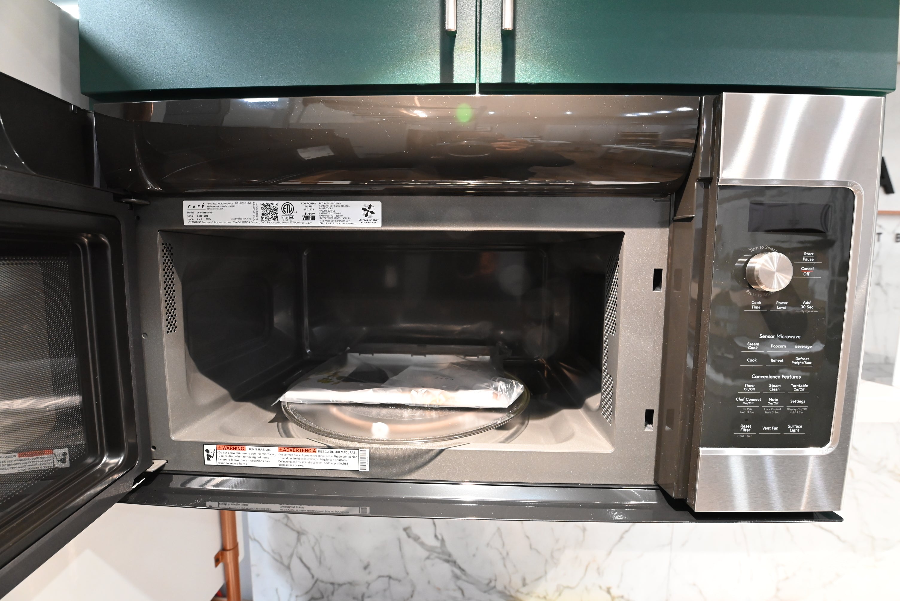 Luxury 30 inch large capacity microwave with 400 CFM ventilation and brushed stainless handle by Cafe