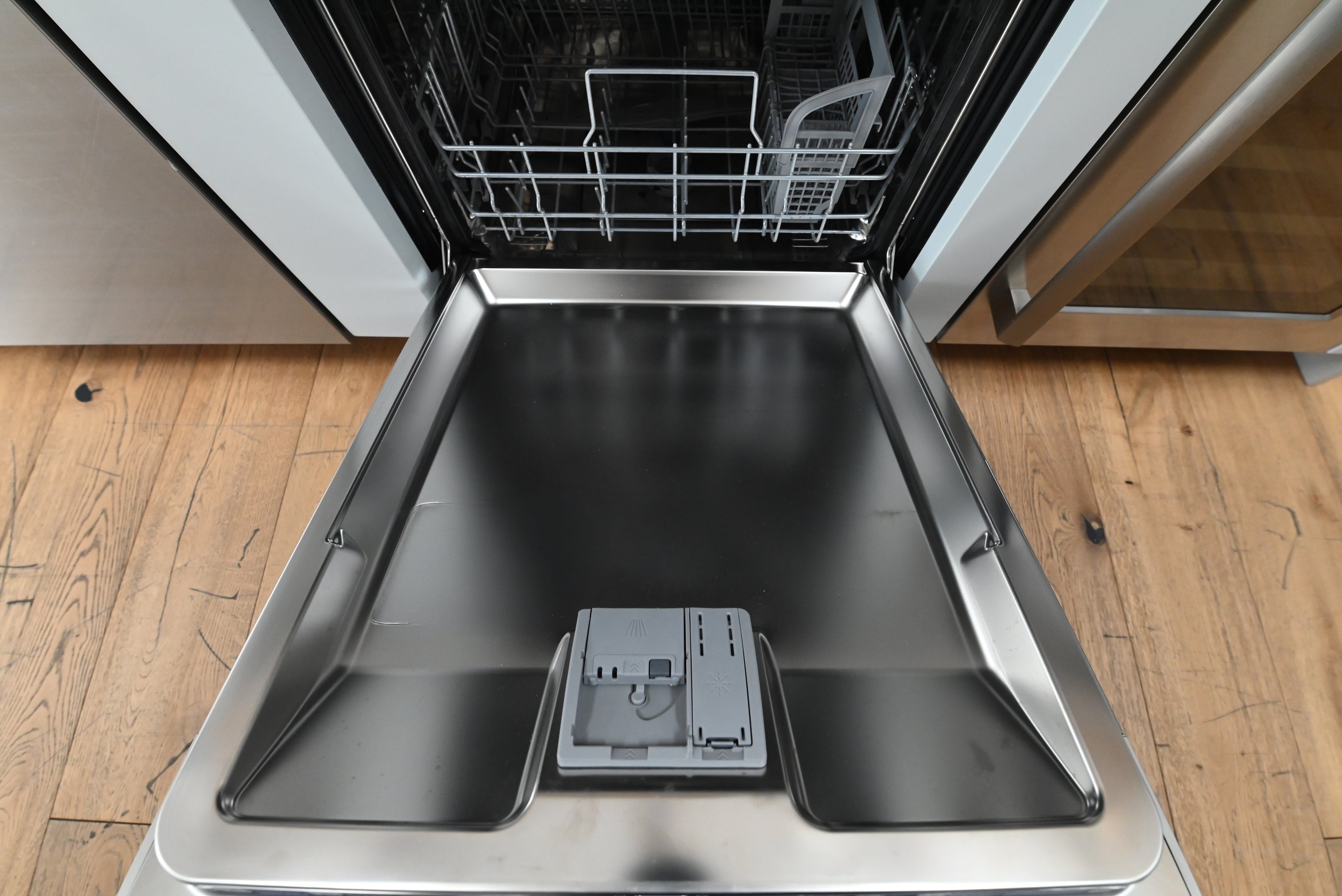 Bosch 24 dishwasher showing sleek front touch controls and integrated recessed pocket handle