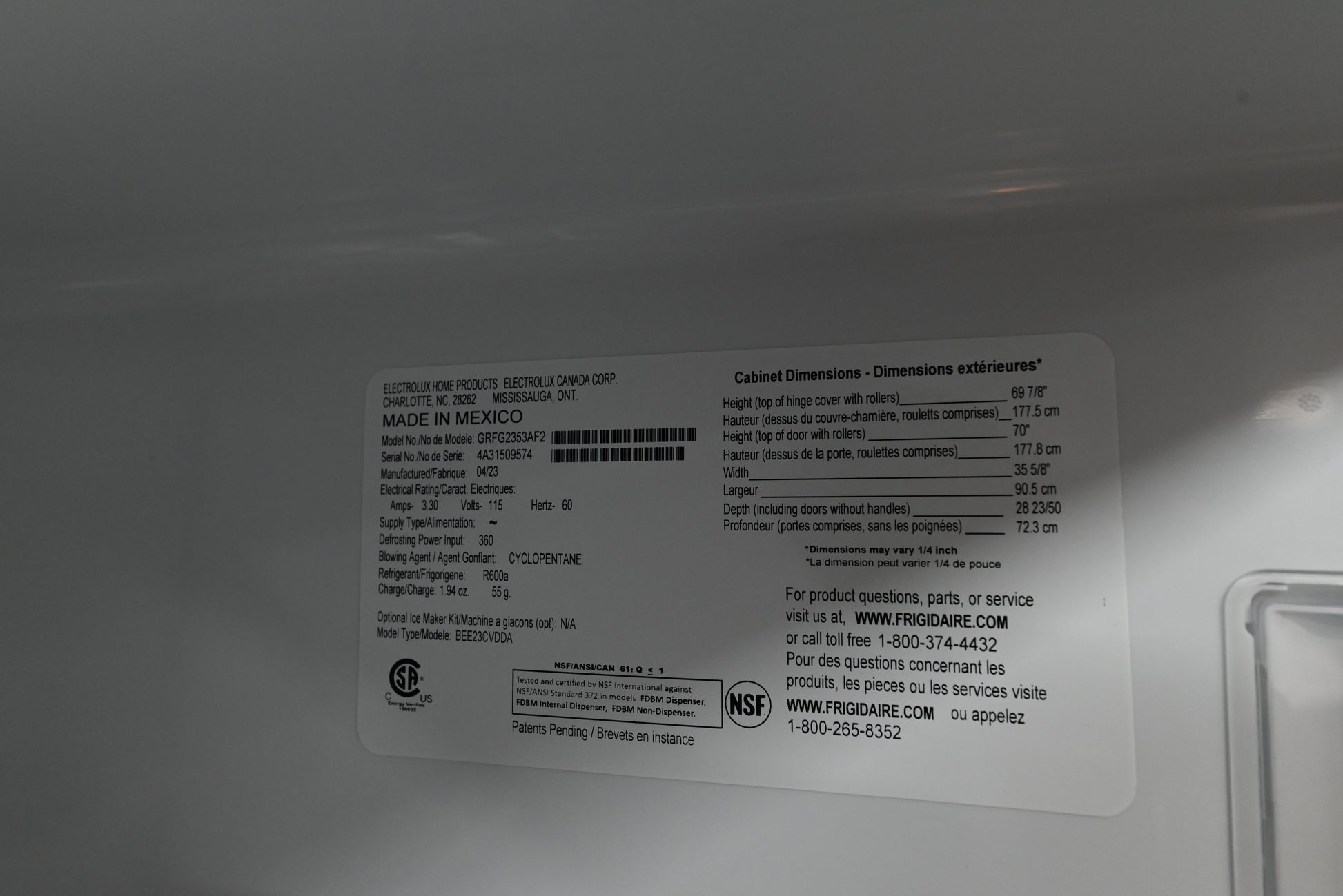 Frigidaire Gallery 36 inch refrigerator sitting flush with modern gray shaker style kitchen cabinets