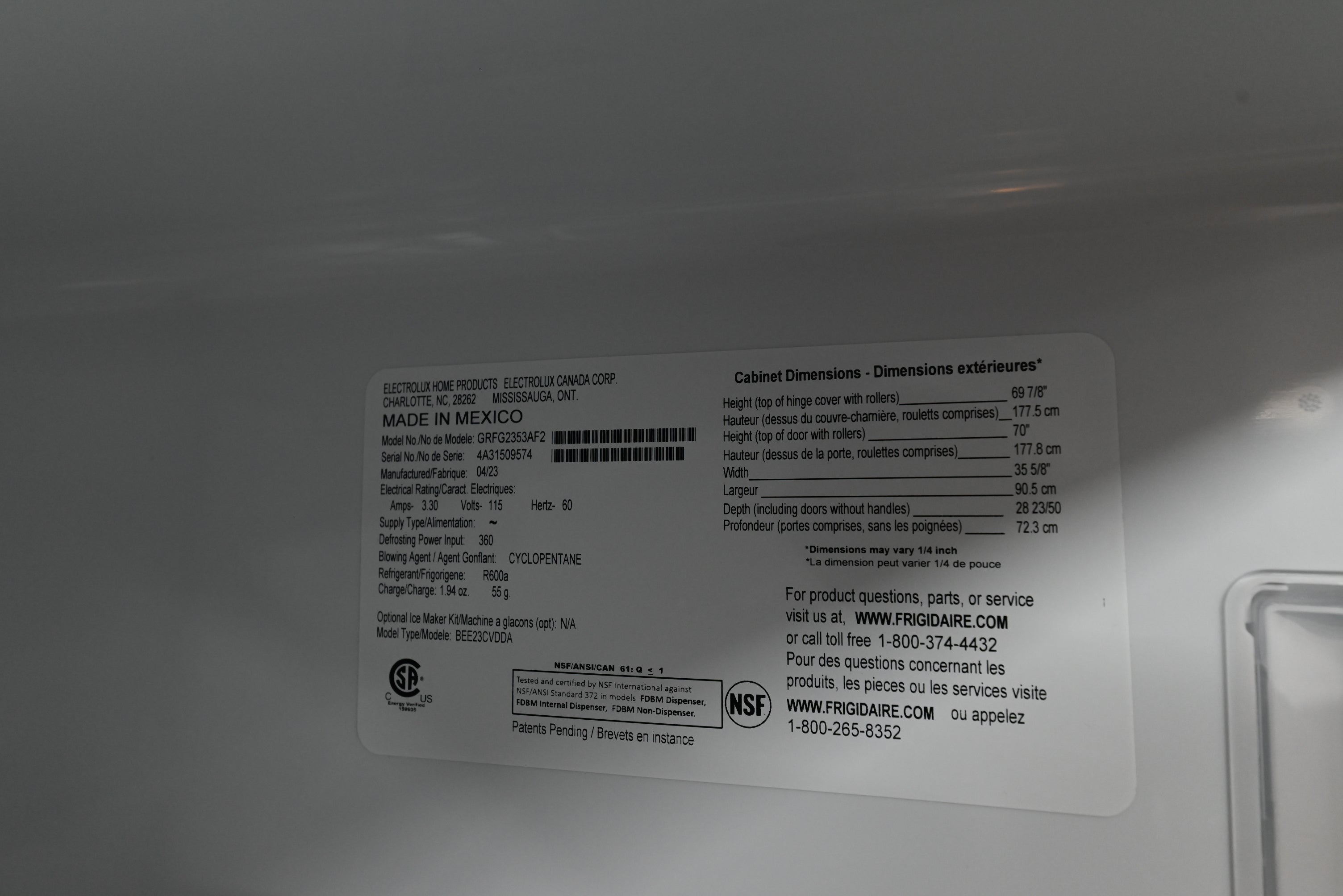 Frigidaire Gallery 36 inch refrigerator sitting flush with modern gray shaker style kitchen cabinets